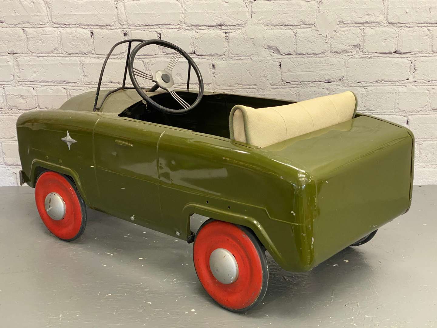 <p>Tri-ang, a mid 20th century pressed steel pedal car,&nbsp;</p>