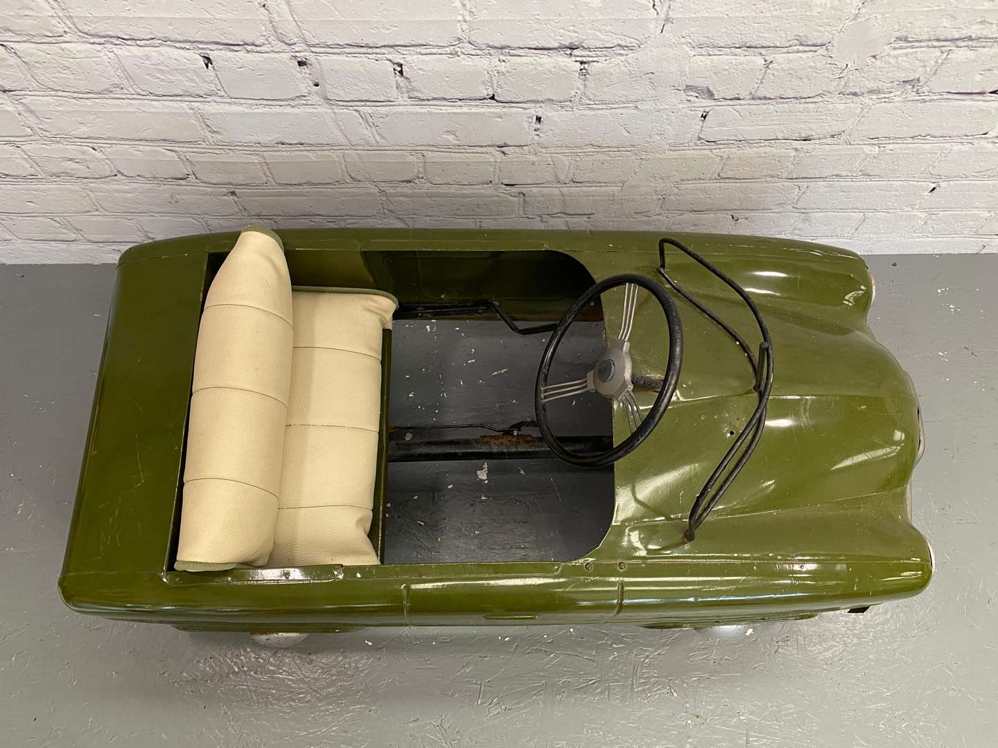 <p>Tri-ang, a mid 20th century pressed steel pedal car,&nbsp;</p>