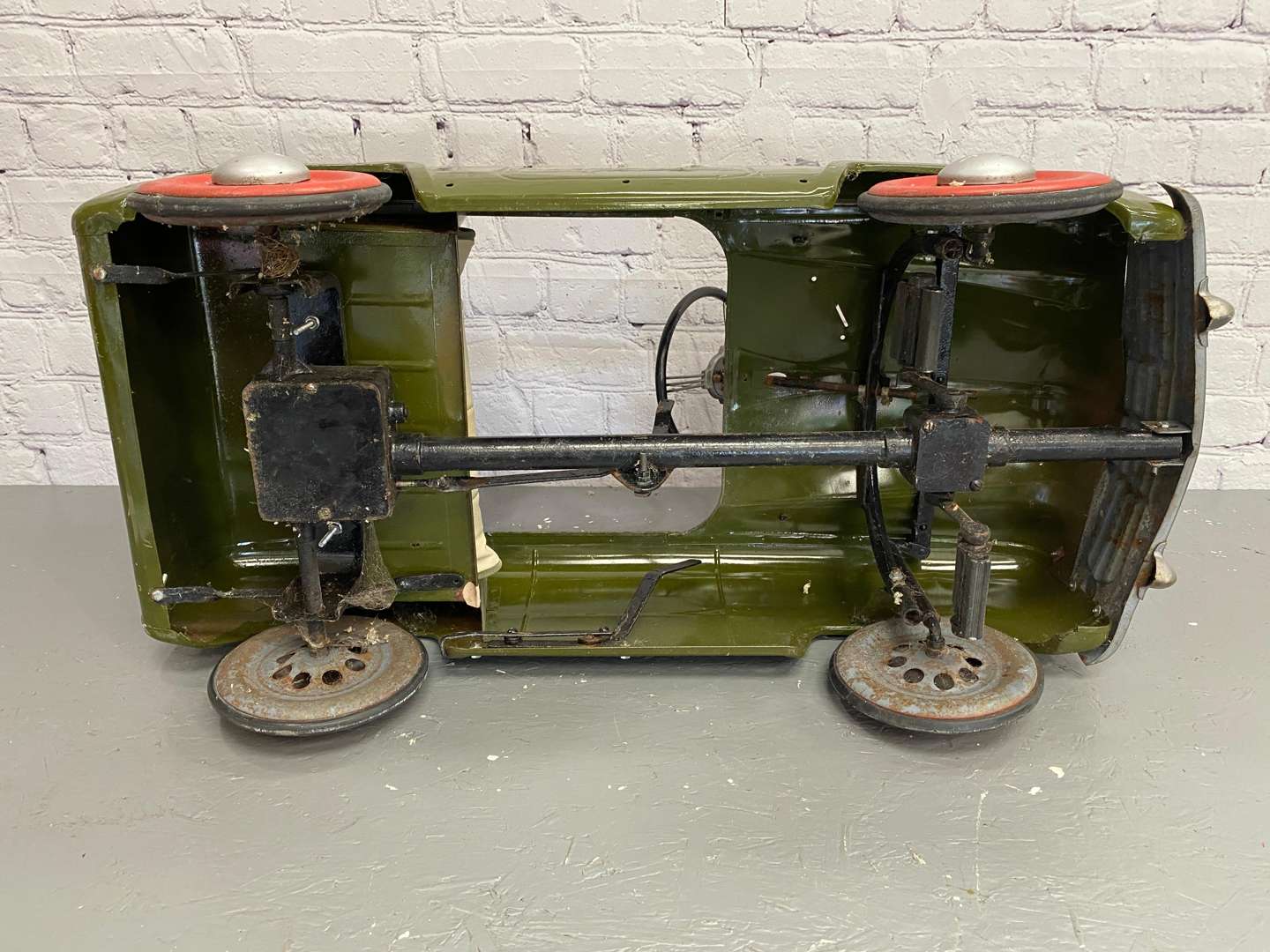 <p>Tri-ang, a mid 20th century pressed steel pedal car,&nbsp;</p>