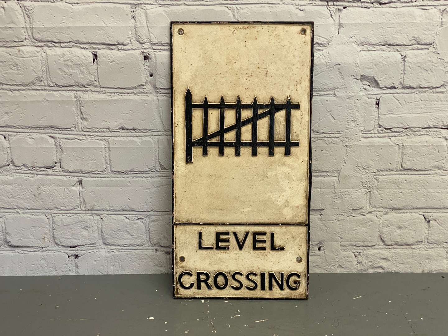 <p>Level Crossing, a modern reproduction cast metal sign,</p>