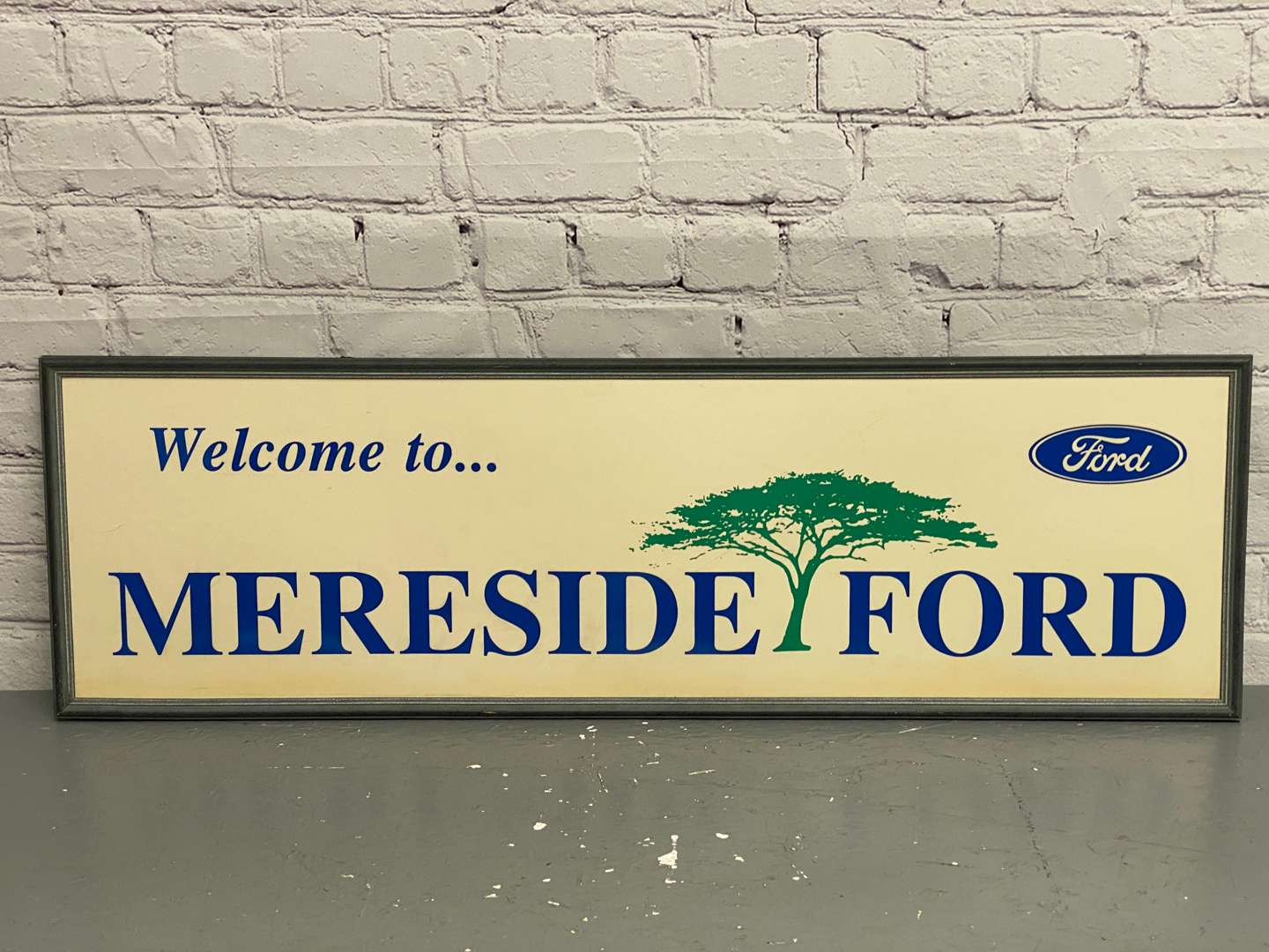 <p>Mereside Ford, a modern framed card dealership sign,</p>