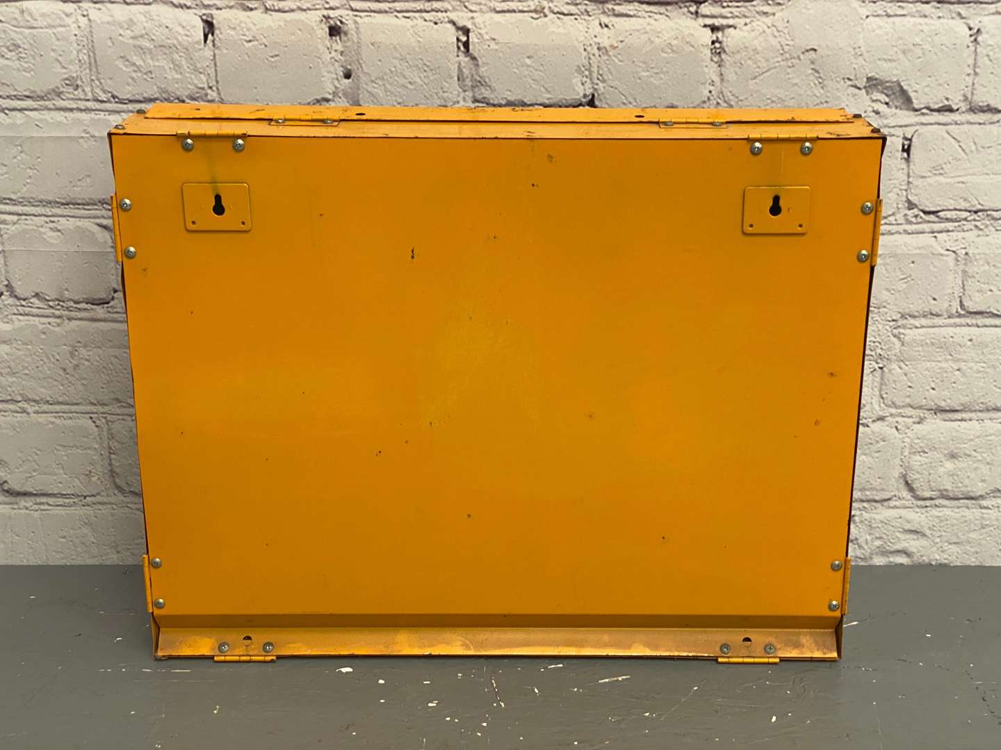 <p>NGK, a modern painted steel, wall mounted spark-plug dispenser,</p>