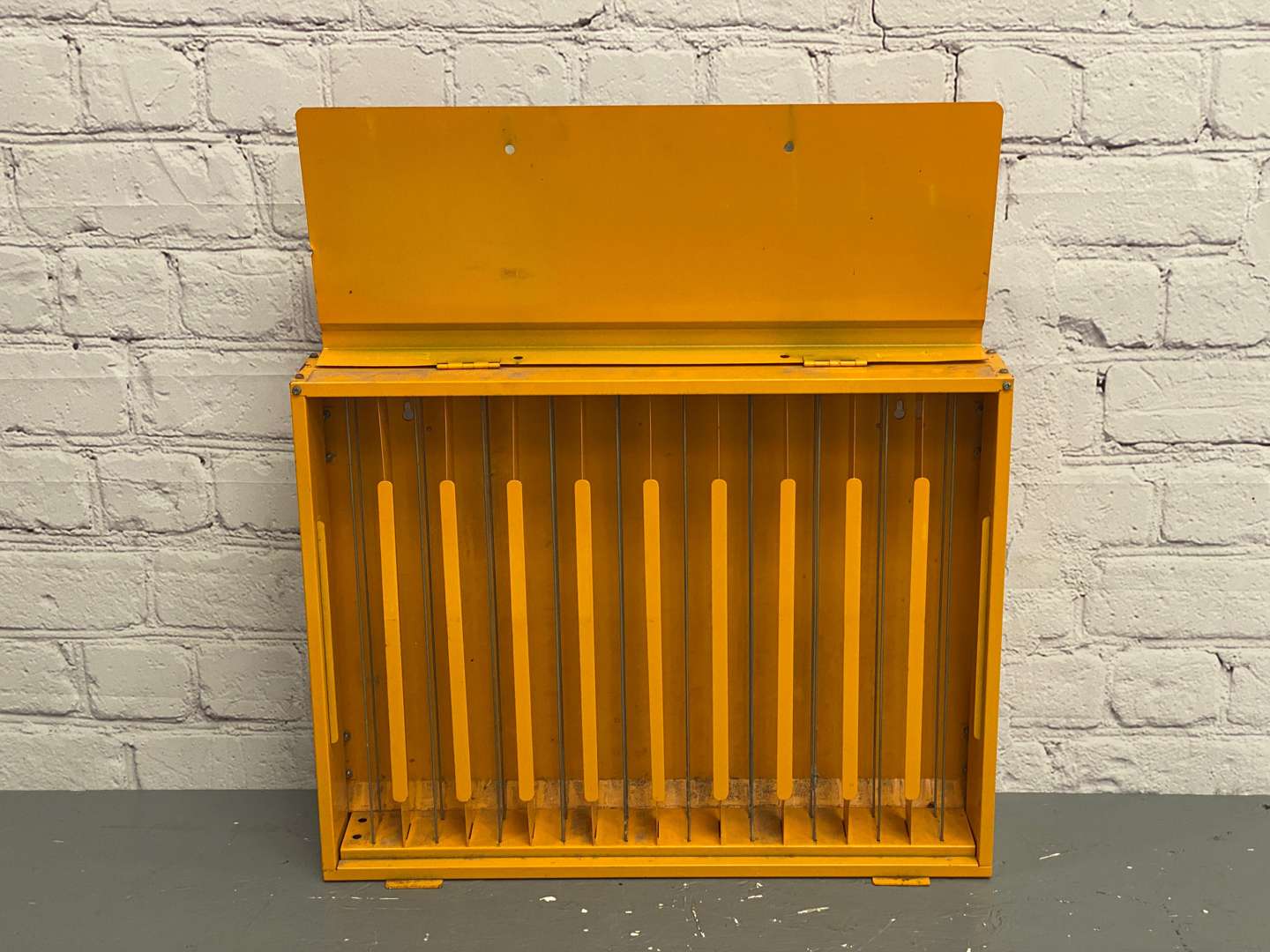 <p>NGK, a modern painted steel, wall mounted spark-plug dispenser,</p>