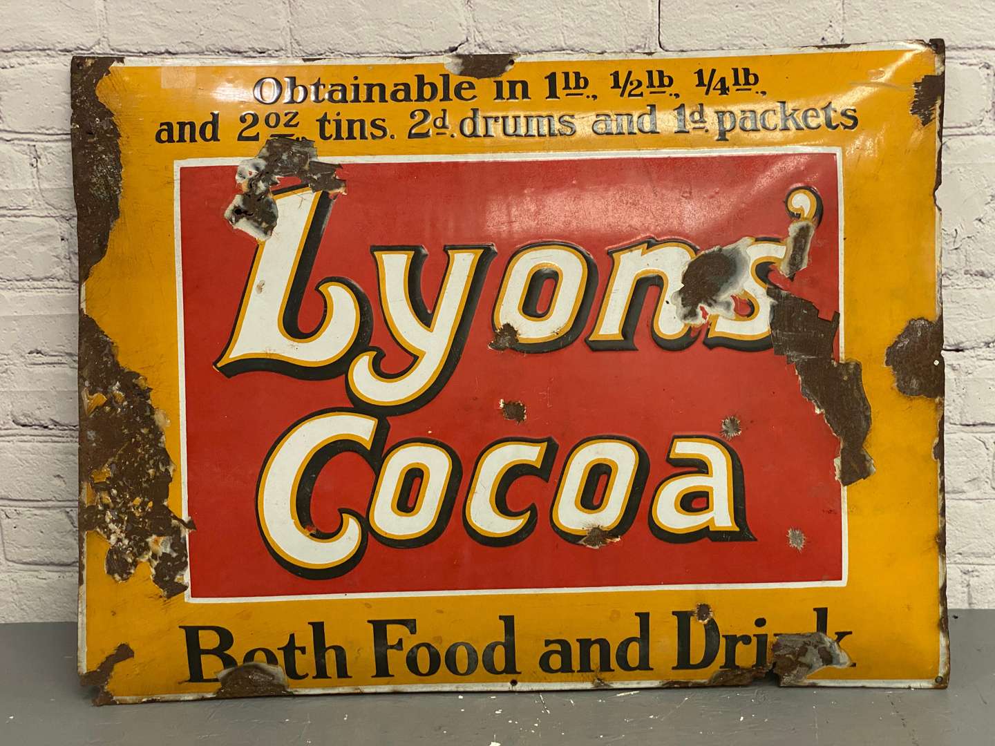 <p>Lyon's Cocoa, a 1930's convex rectangular sign,</p>