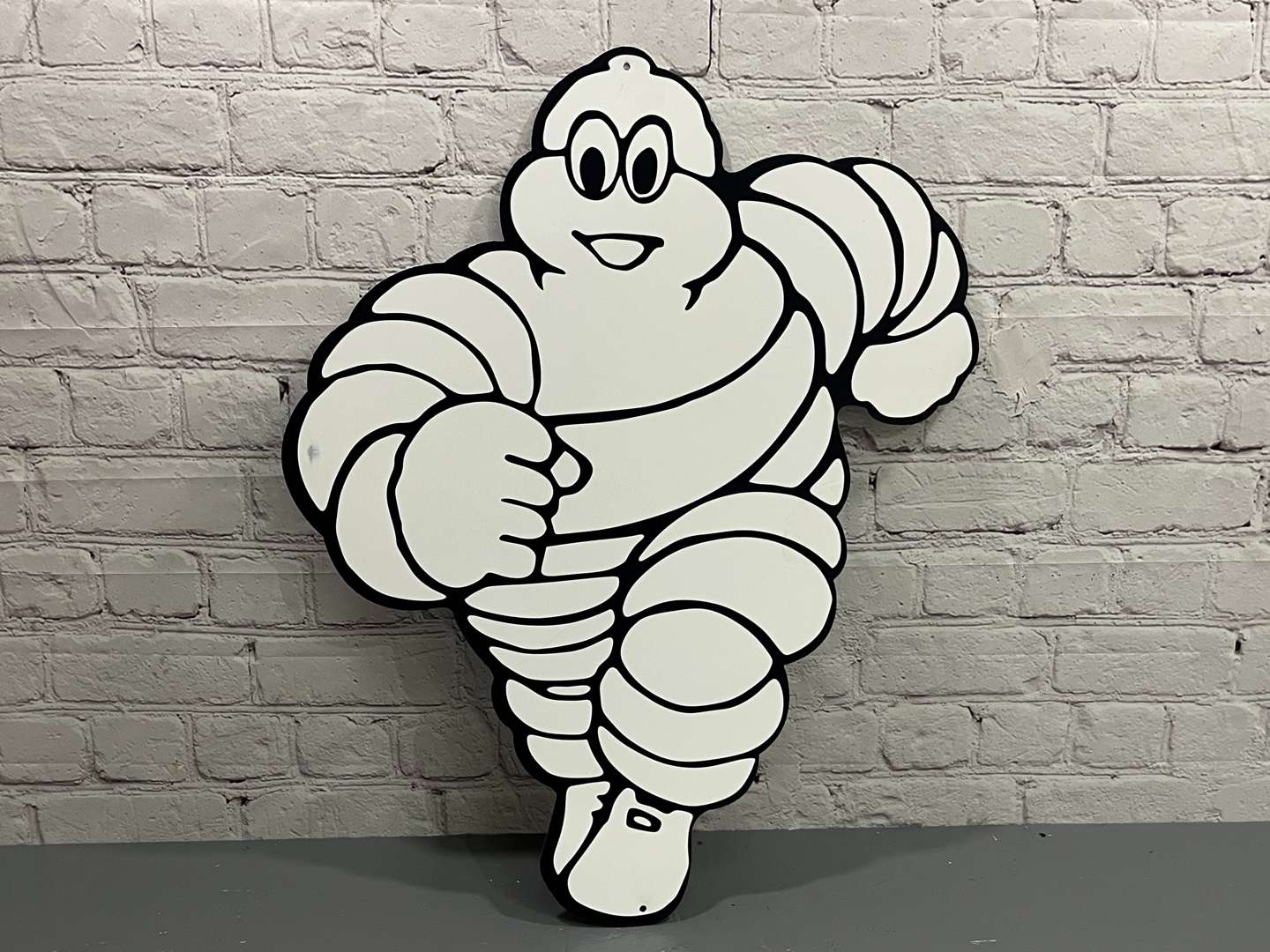 <p>Michelin Metal Running Man Sign</p>