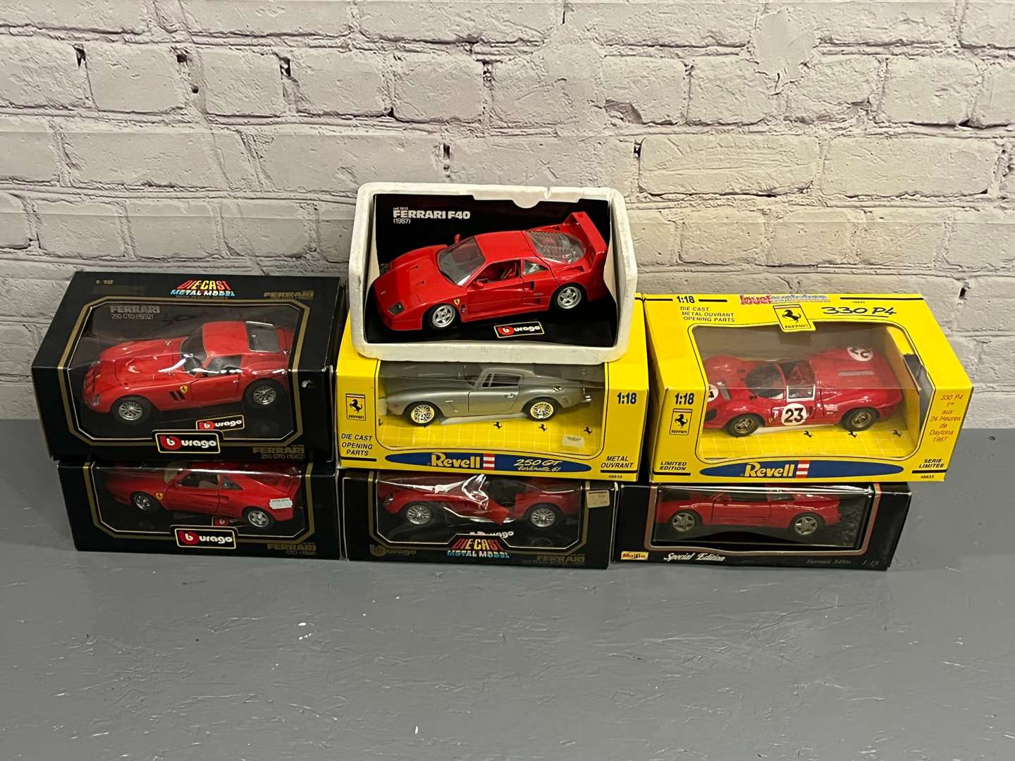 <p>Seven Ferrari 1:18 Scale Models&nbsp;</p>