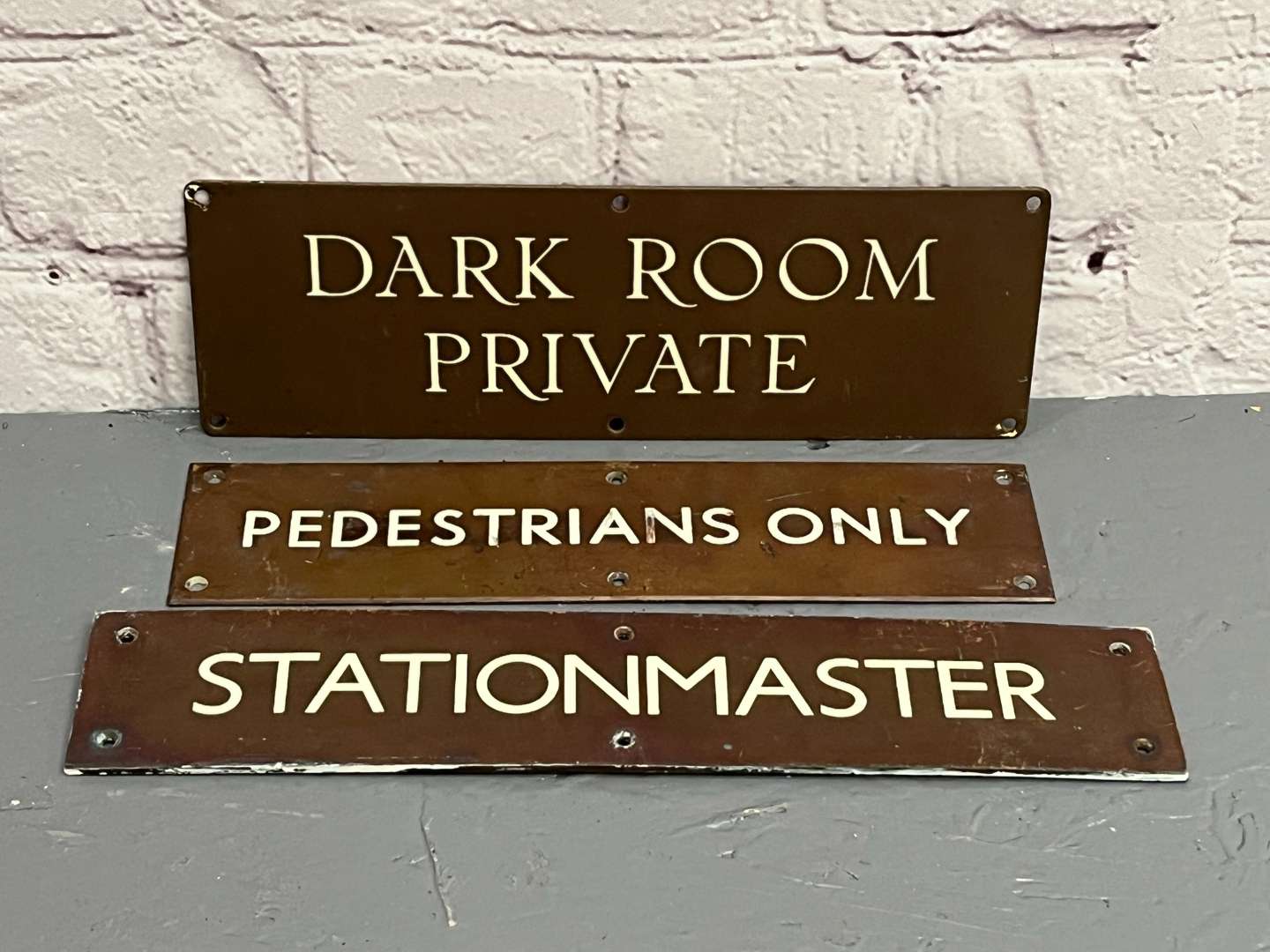 <p>Three Bronze Signs&nbsp;</p>