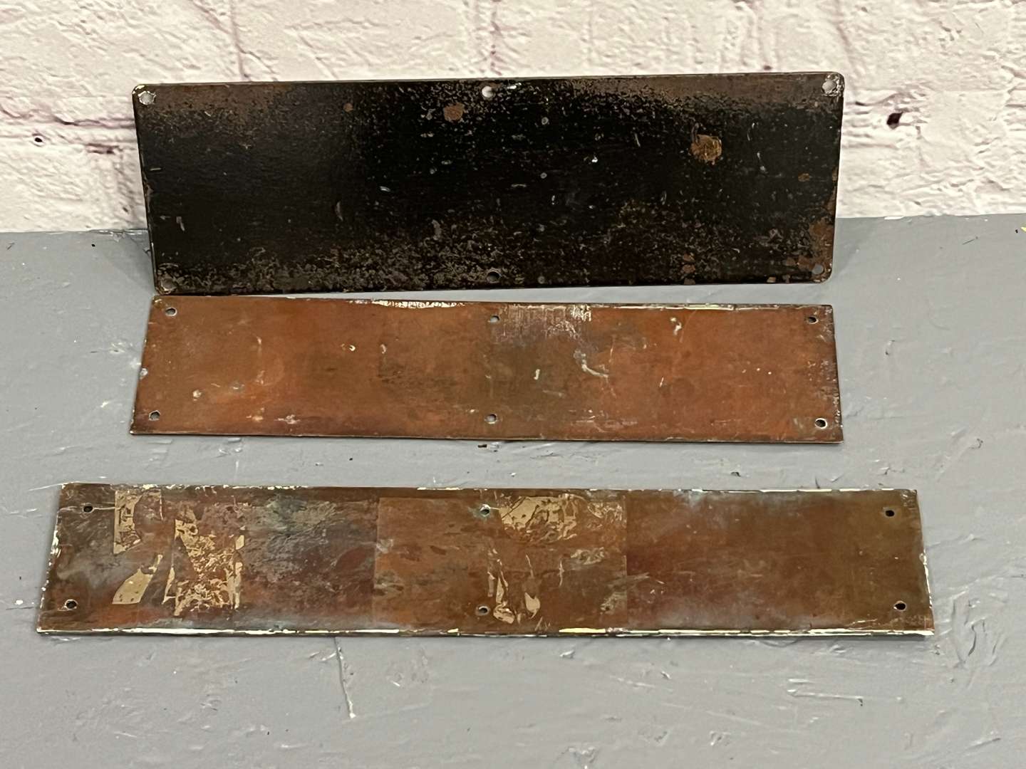 <p>Three Bronze Signs&nbsp;</p>