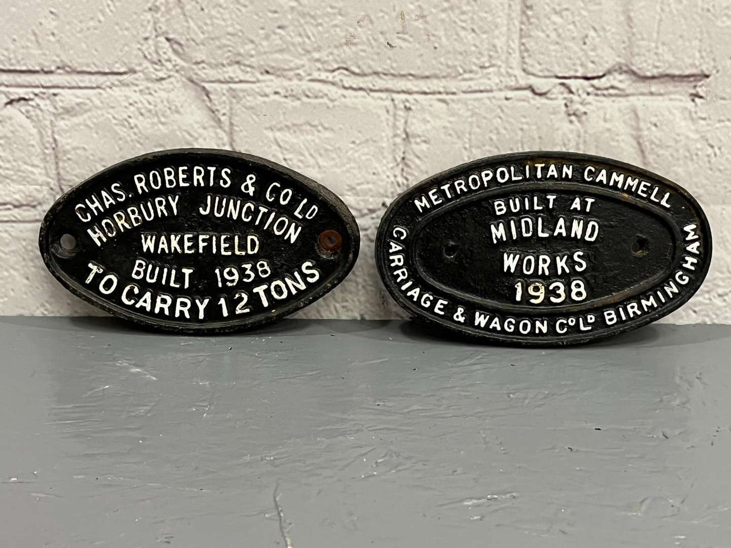 <p>Two Cast Iron Wagon Plates Dated 1938</p>
