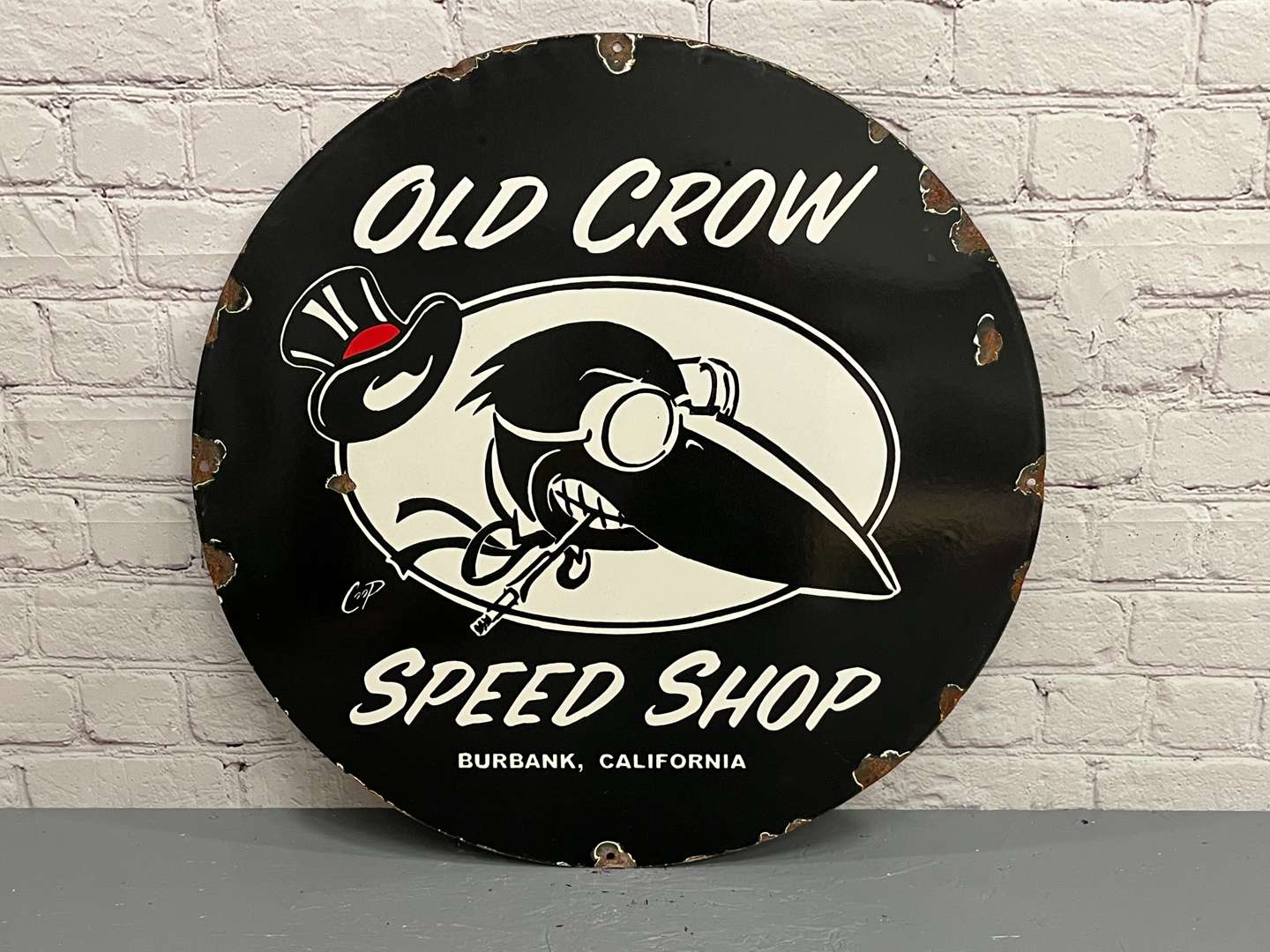 <p>Old Crow Speed Shop Circular Enamel Sign</p>