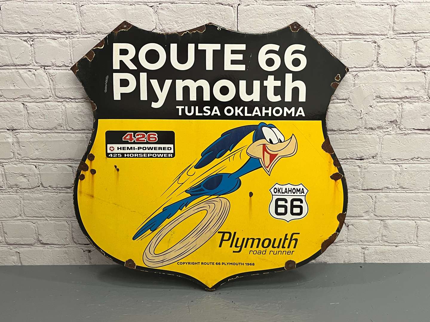 <p>Route 66 Plymouth Road Runner Enamel Shield Sign</p>