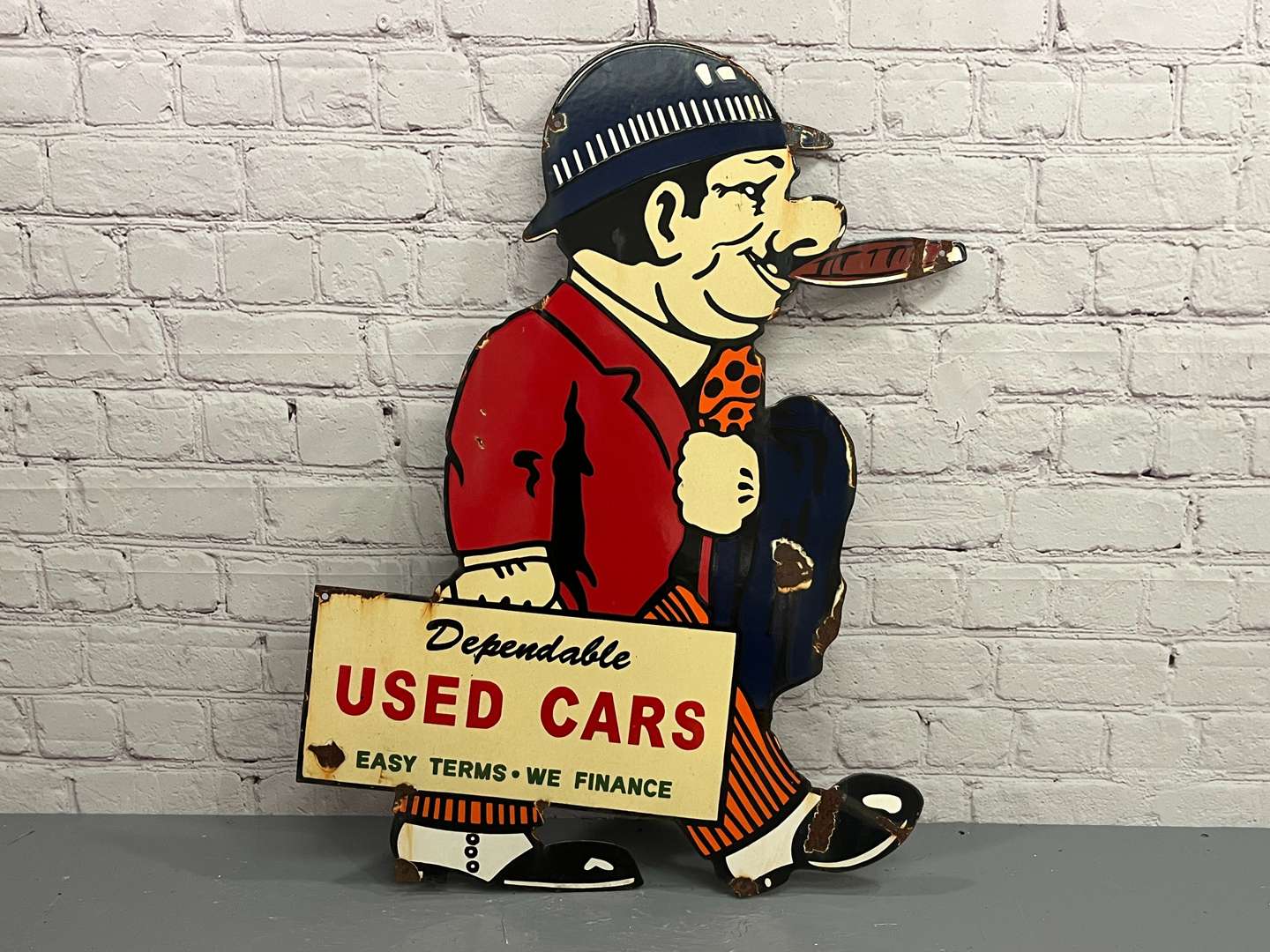 <p>Dependable Used Car Salesman Enamel Sign</p>
