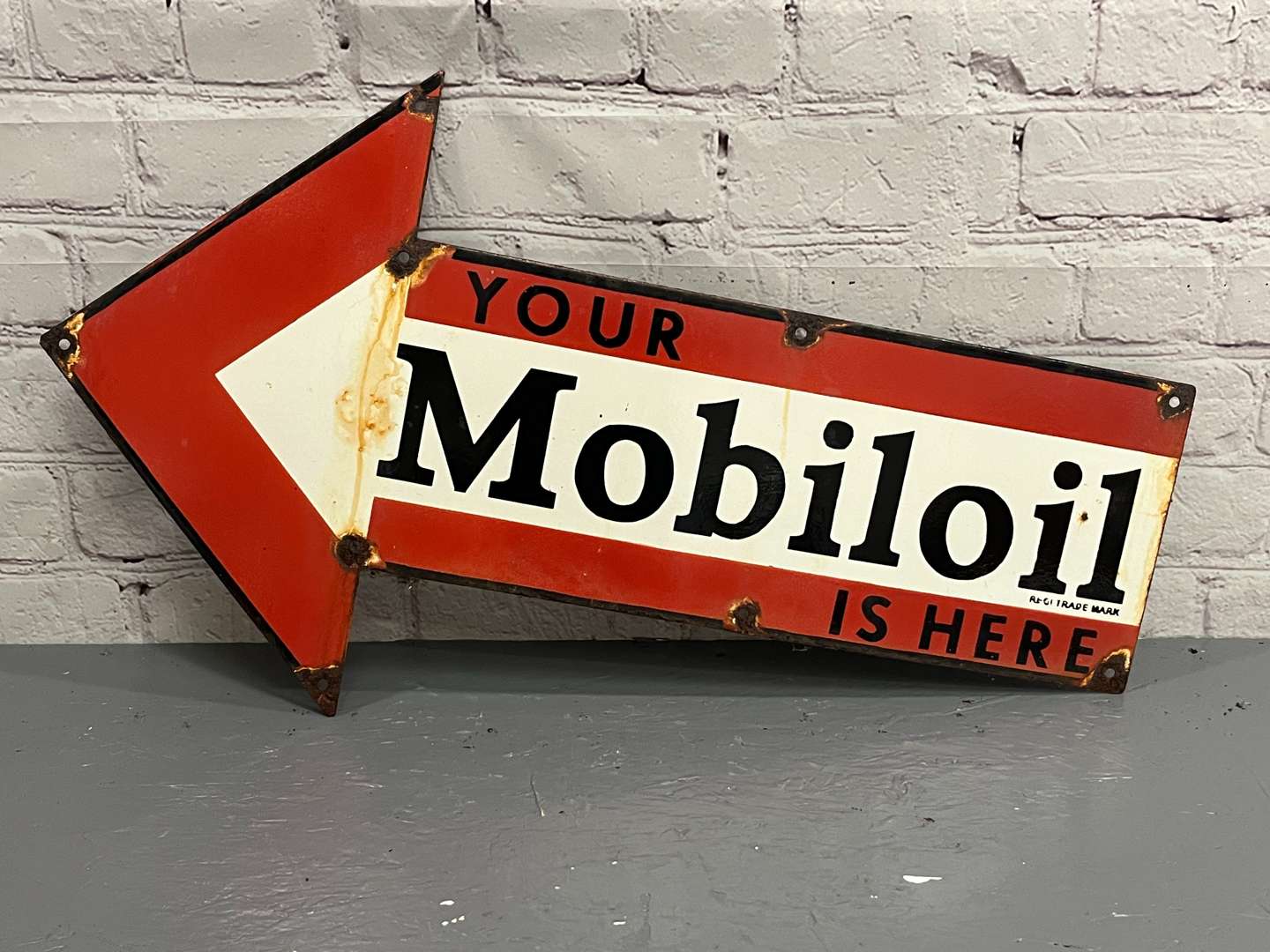 <p>Your Mobiloil Is Here Arrow Enamel Sign</p>