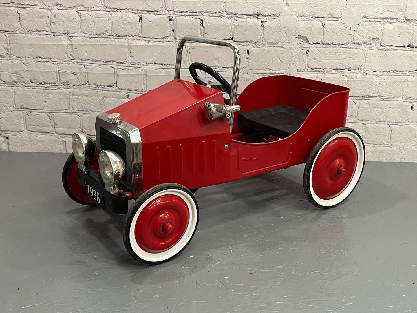 <p>Modern Tin Plate Childs Pedal Car</p>