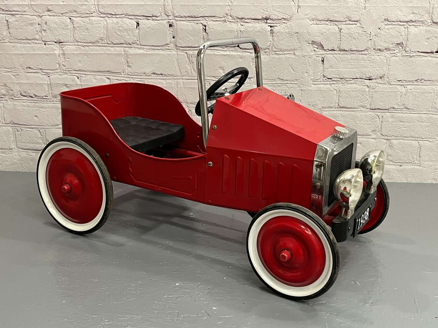 <p>Modern Tin Plate Childs Pedal Car</p>