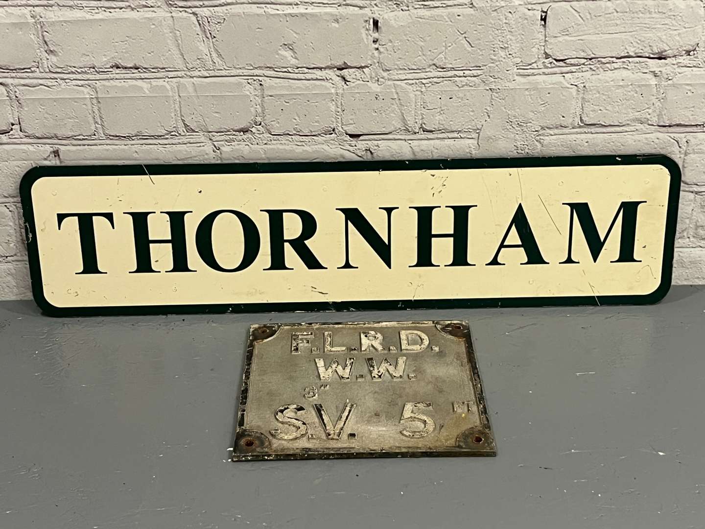 <p>Thornham Village Sign and Cast Aluminium Water Main Sign (2)</p>