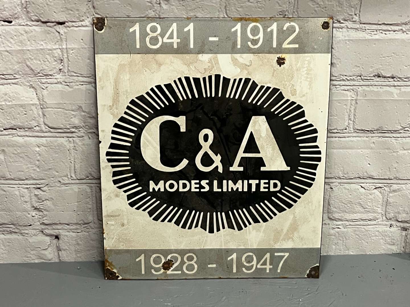 <p>C&A Modes Limited Enamel Sign</p>