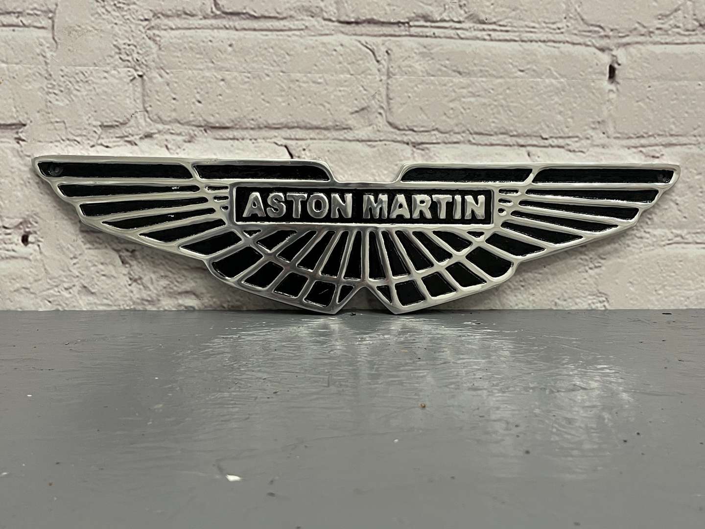 <p>Aston Martin Aluminium Emblem Sign</p>