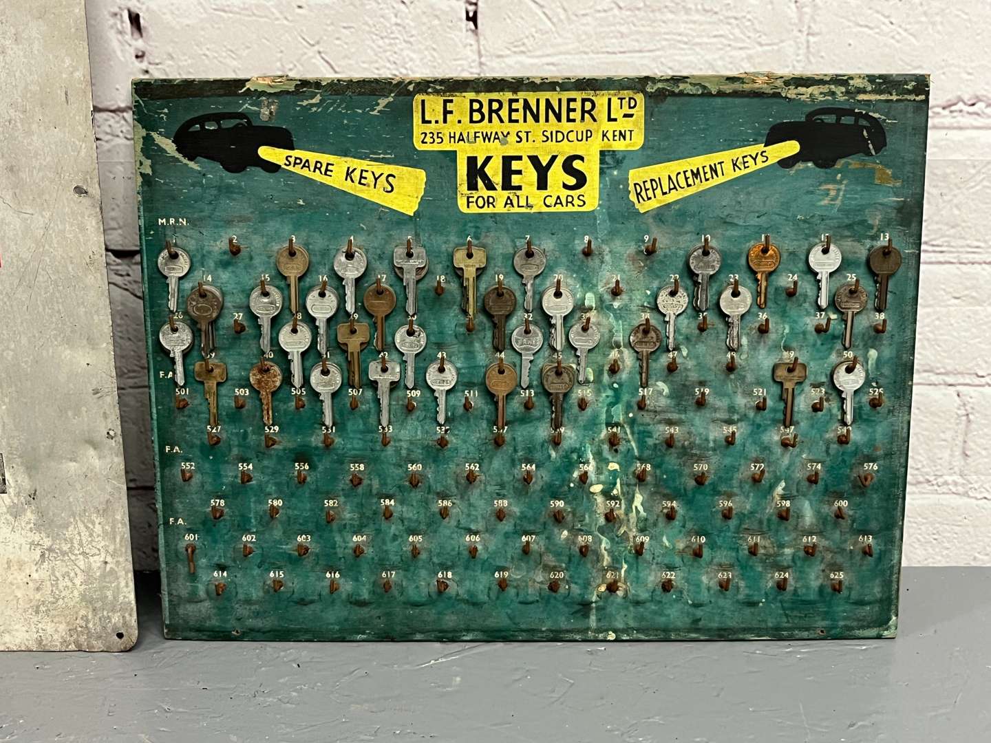 <p>Elf Oils Sign and LF Brenner Ltd Key Board</p>