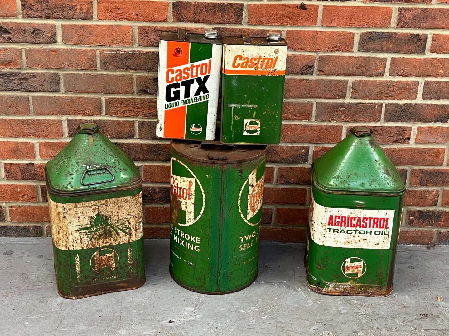 <p>Five Castrol Oil Cans/Drums&nbsp;</p>