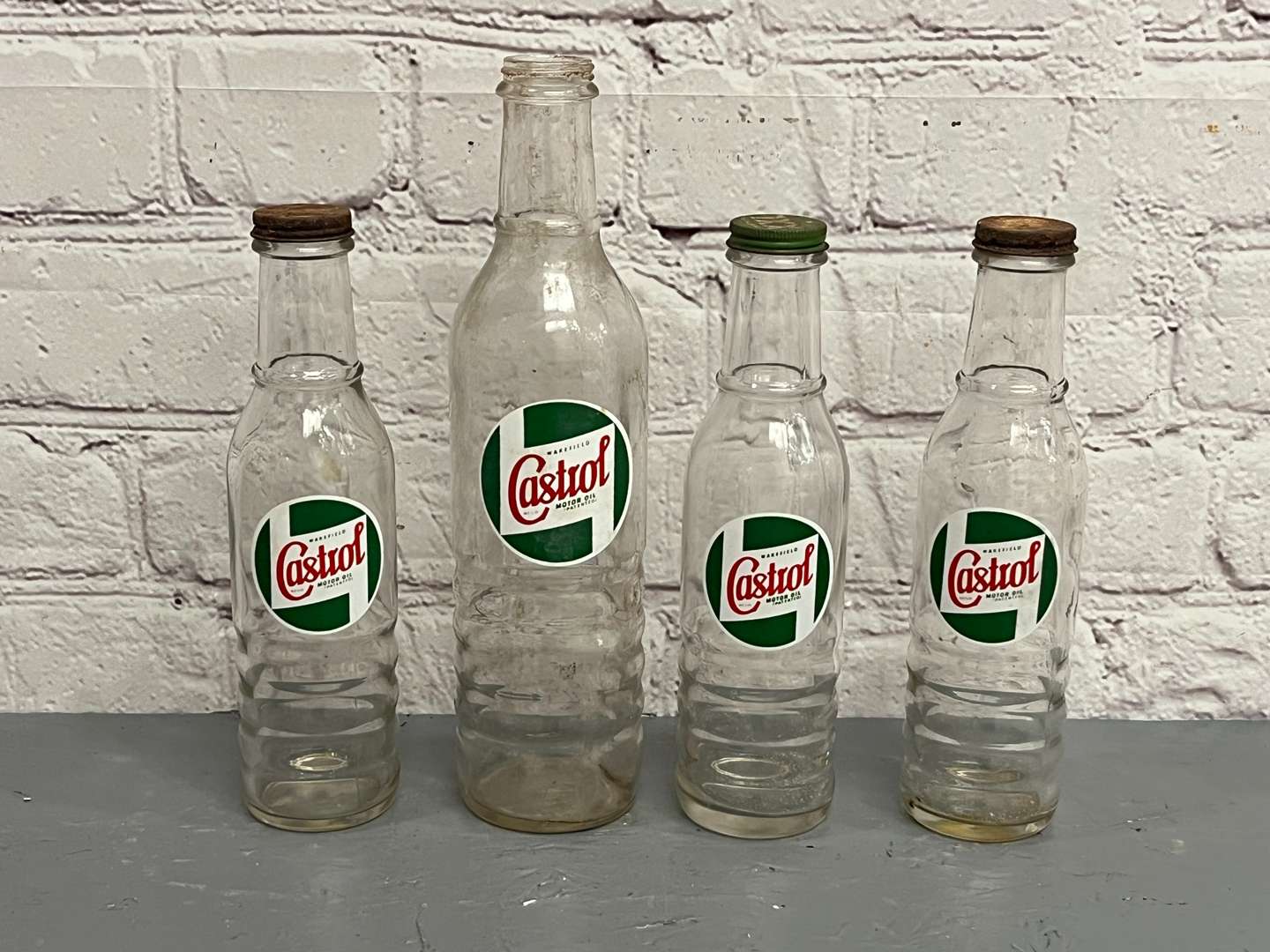 <p>Four Glass Castrol Oil Bottles&nbsp;</p>