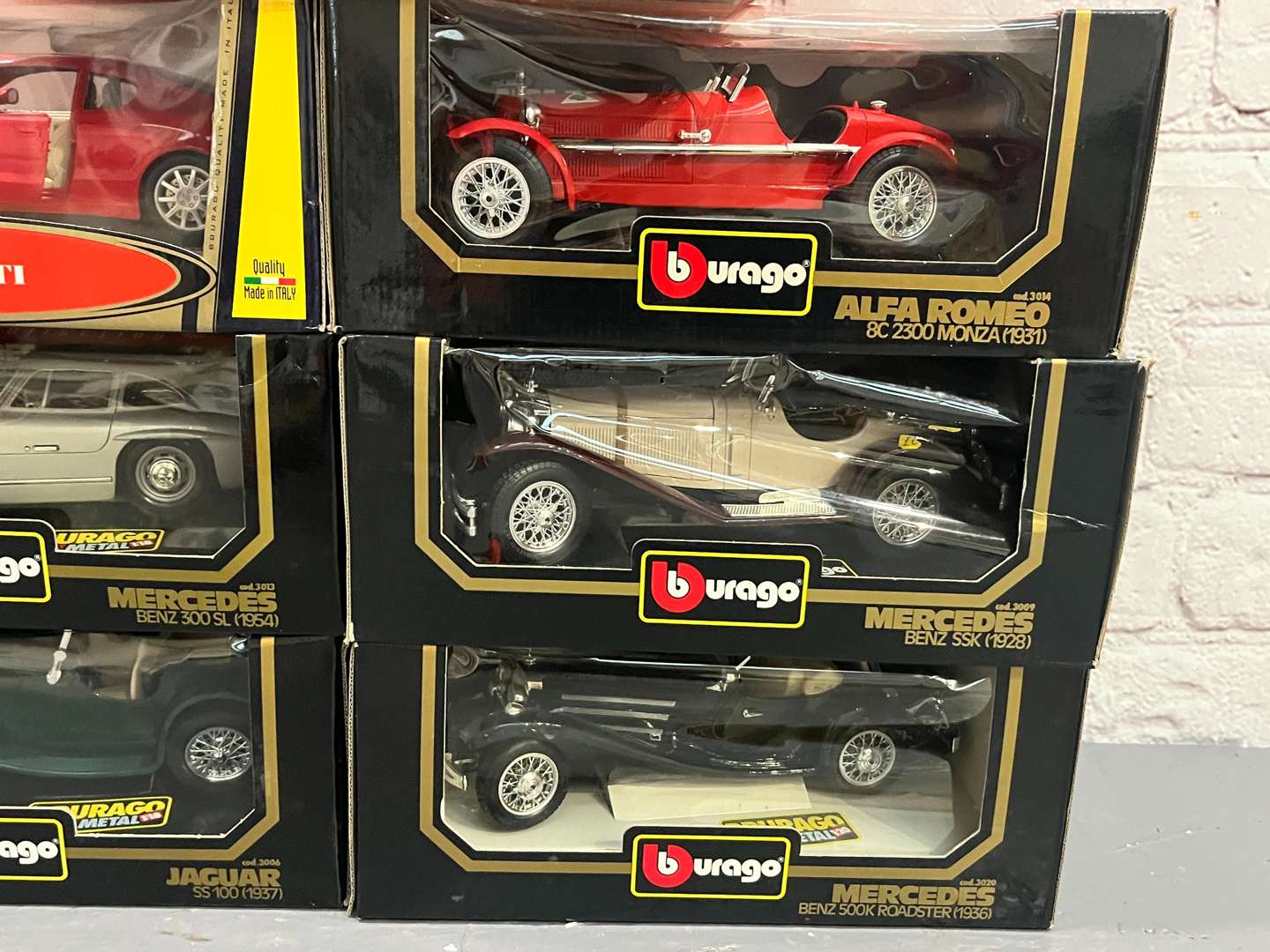 <p>Seven 1:18 Scale Boxed Burago Model Cars</p>