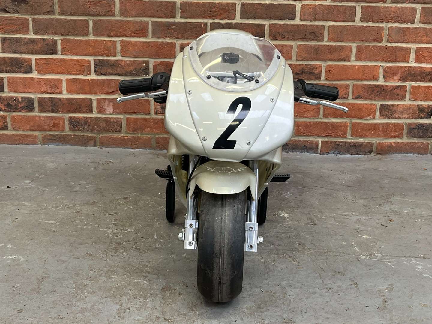 <p>Miniature 49cc Motorcycle and Stand</p>