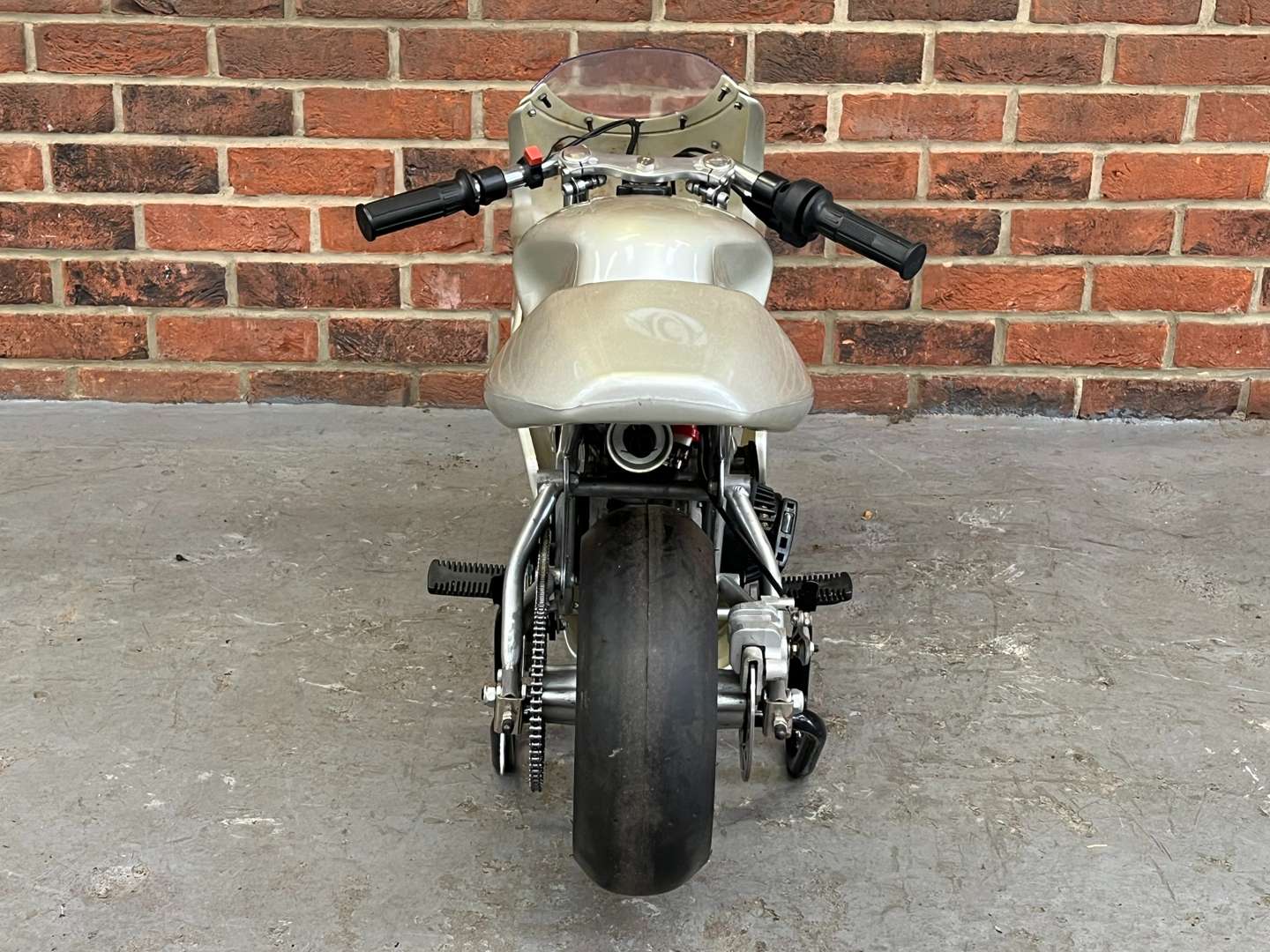 <p>Miniature 49cc Motorcycle and Stand</p>