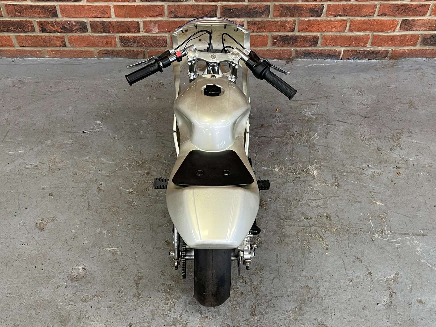 <p>Miniature 49cc Motorcycle and Stand</p>