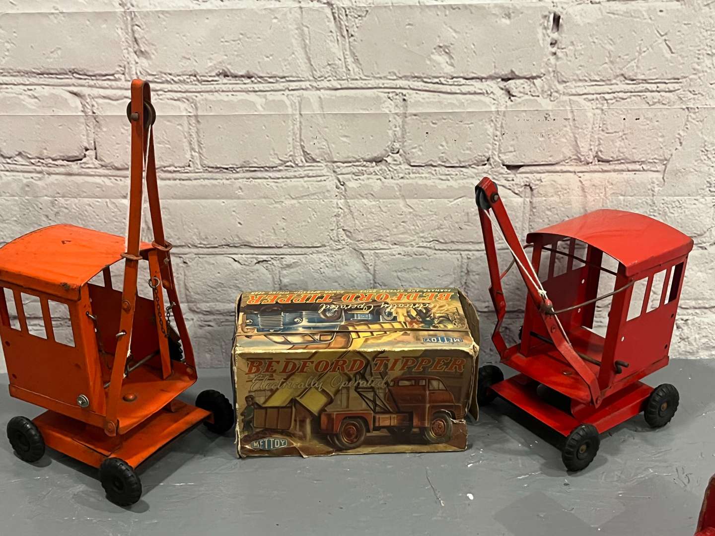 <p>Two Tri-ang Cranes, Boxed Mettoy Bedford Tipper Truck Etc</p>