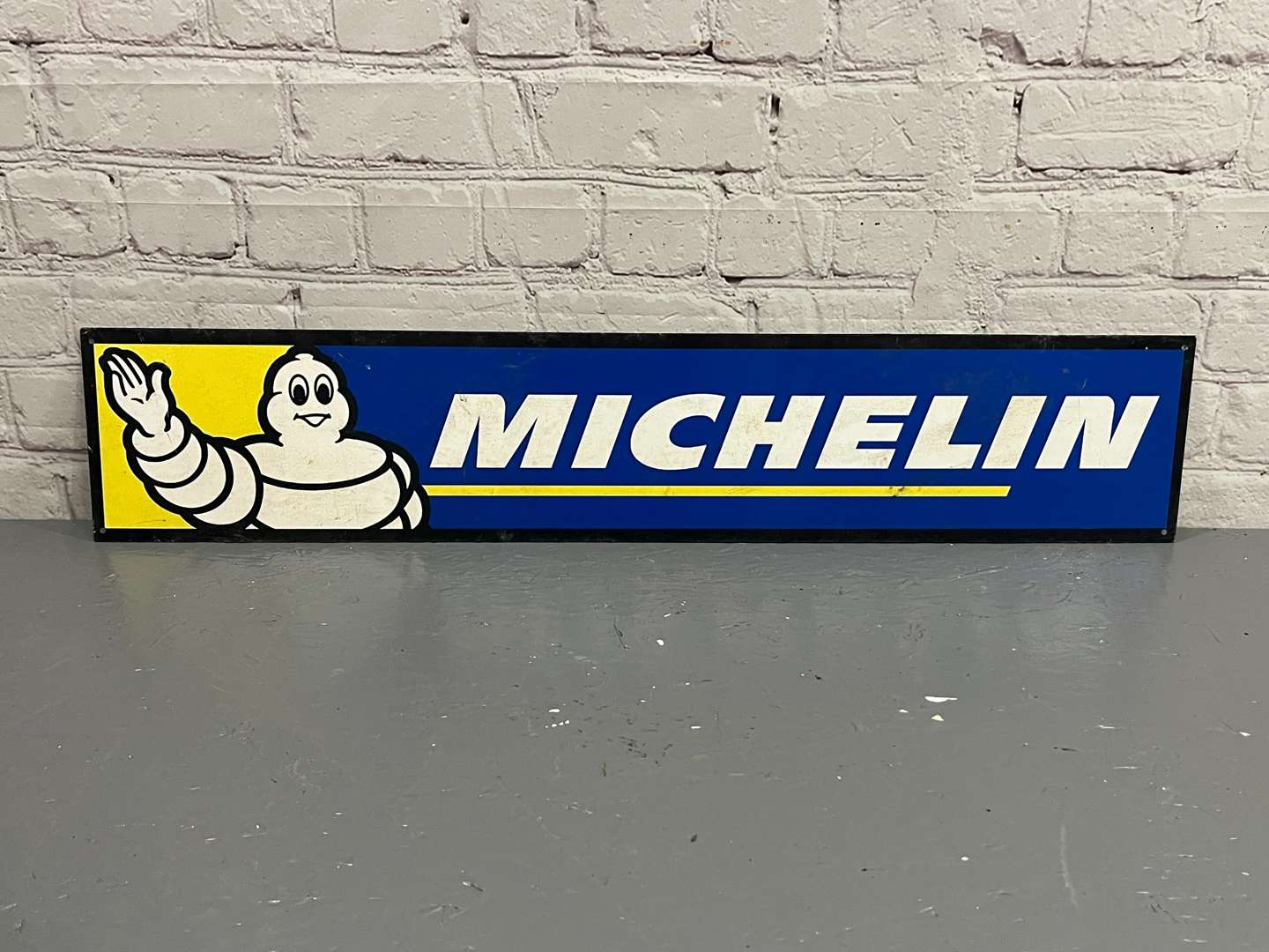 <p>Michelin Metal Running Man Sign</p>