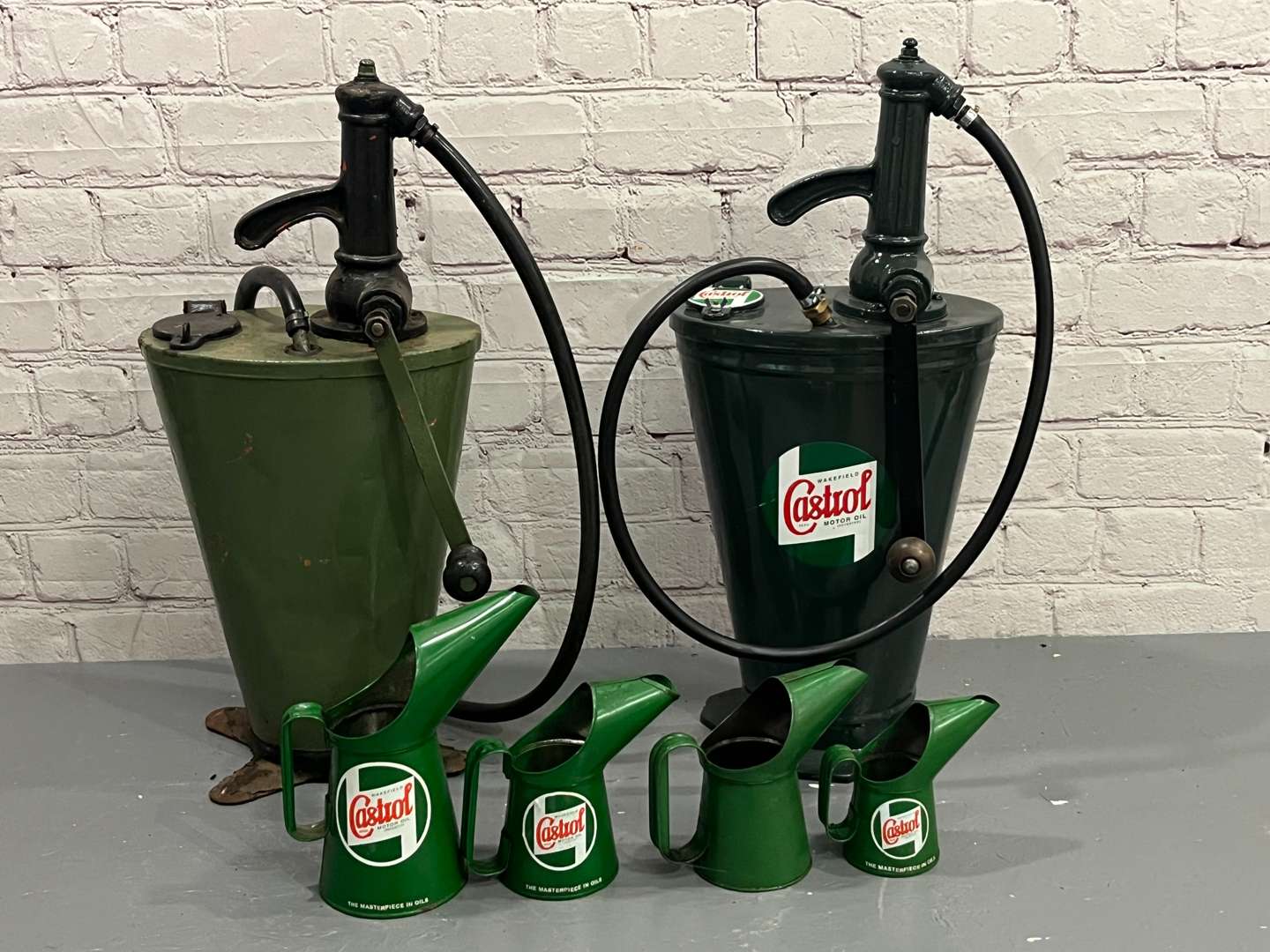 <p>Two Castrol Forecourt Dispensers and Four Oil Pourers</p>