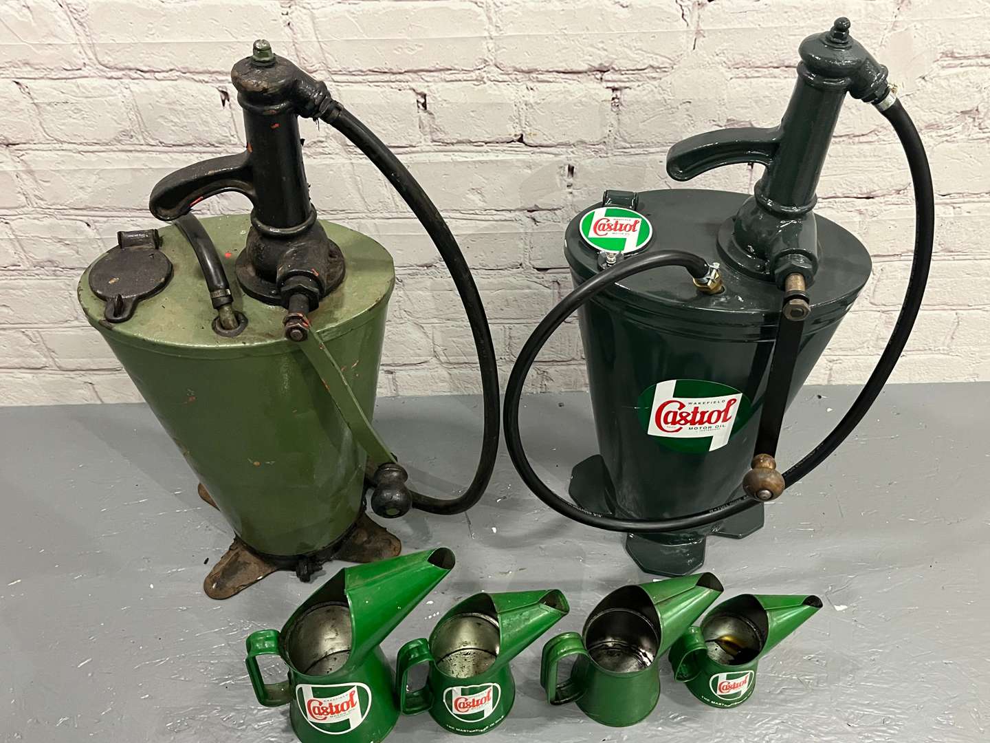 <p>Two Castrol Forecourt Dispensers and Four Oil Pourers</p>