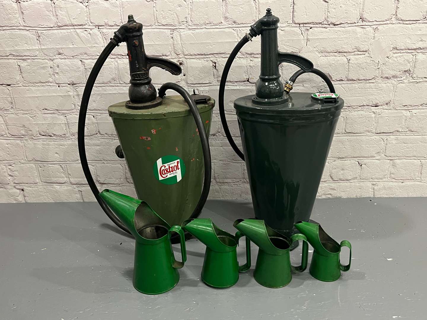 <p>Two Castrol Forecourt Dispensers and Four Oil Pourers</p>