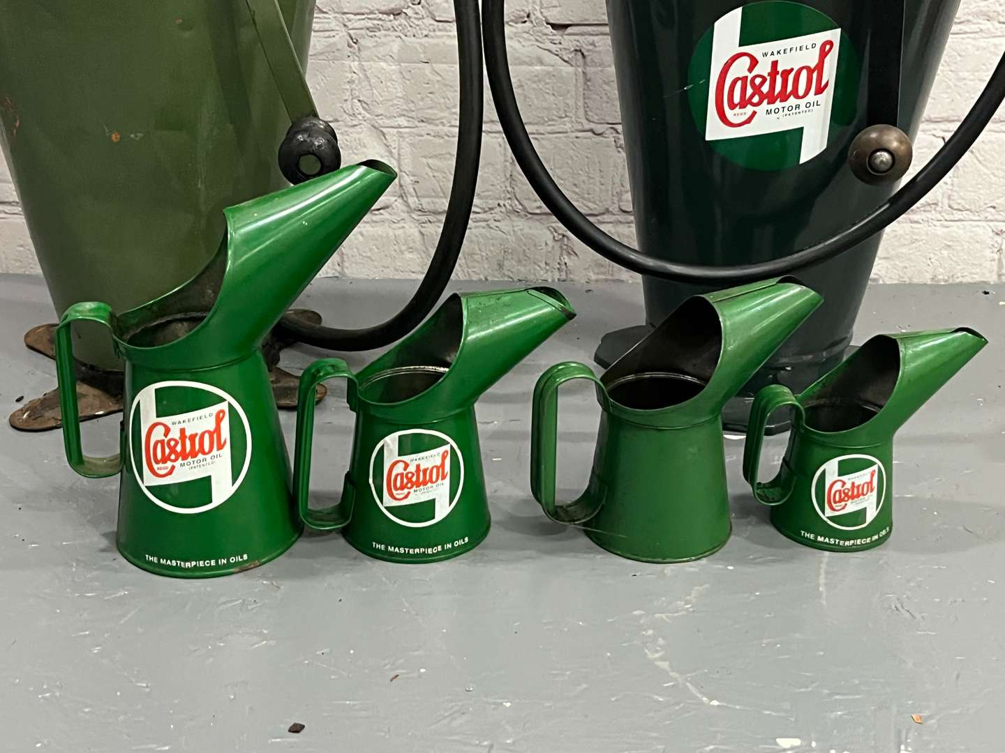 <p>Two Castrol Forecourt Dispensers and Four Oil Pourers</p>