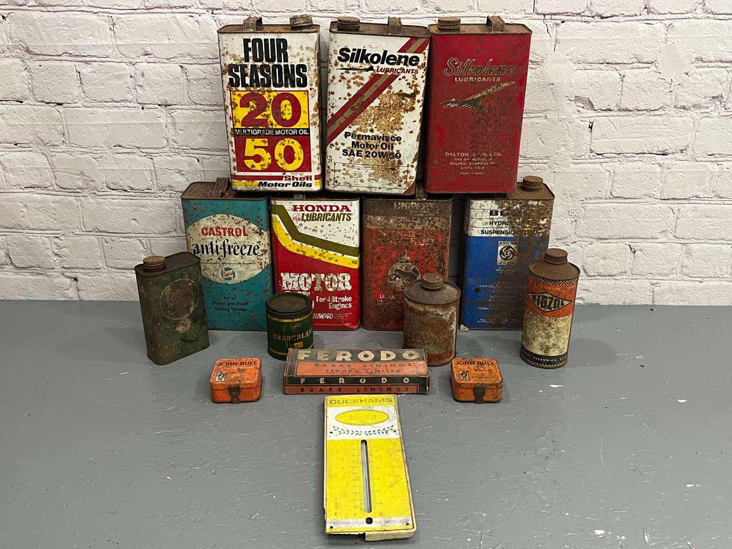 <p>Two Boxes of Vintage Oil Cans and Duckhams Thermometer&nbsp;</p>