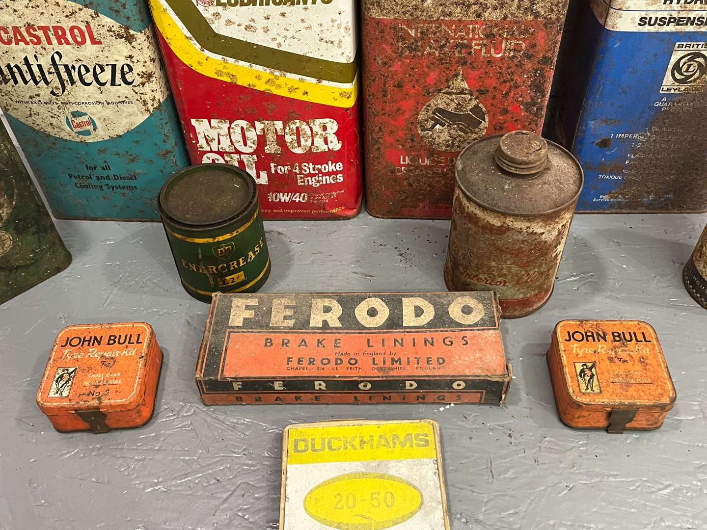 <p>Two Boxes of Vintage Oil Cans and Duckhams Thermometer&nbsp;</p>