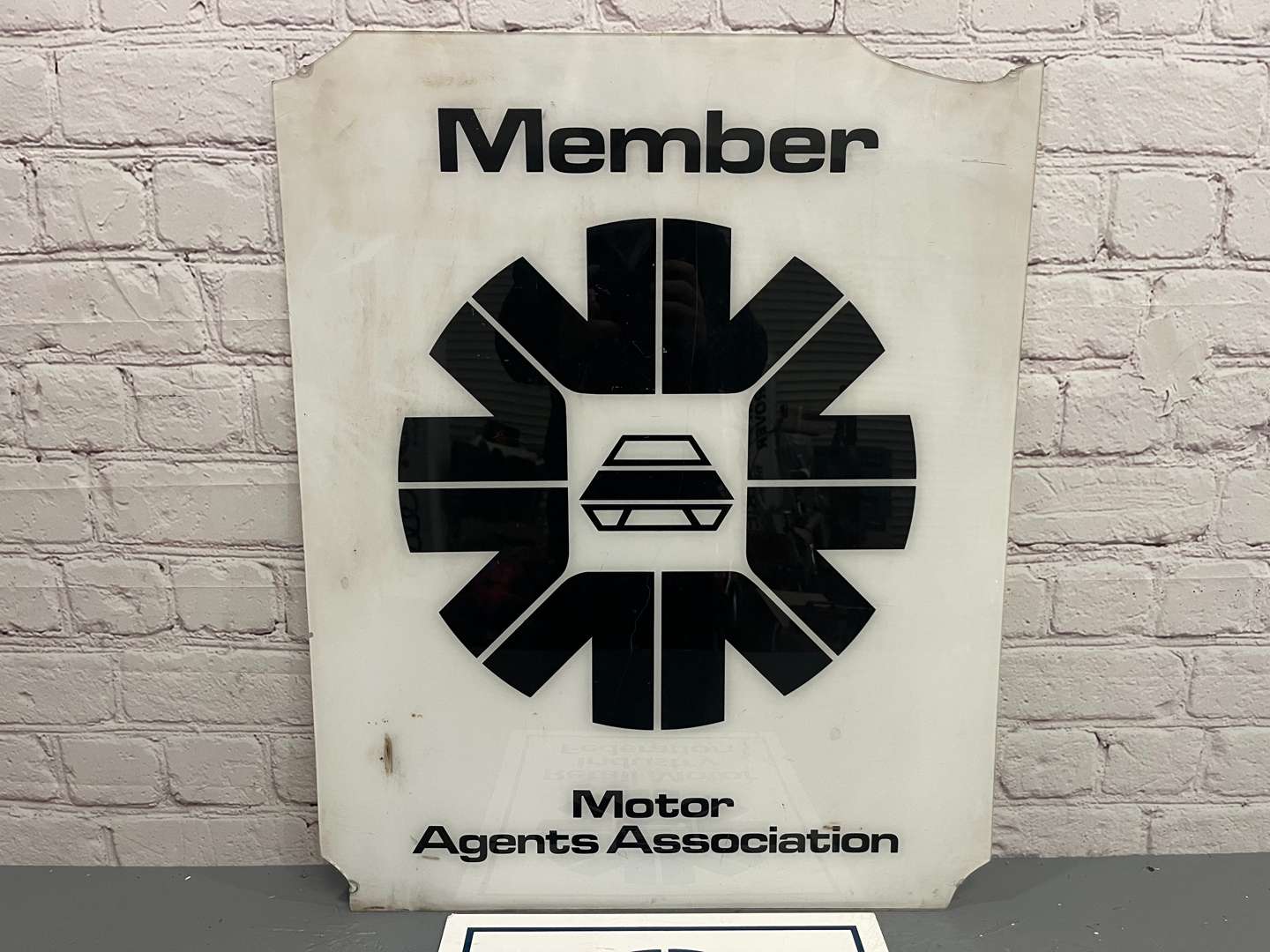 <p>Two Plastic Motor Agents Association Signs</p>