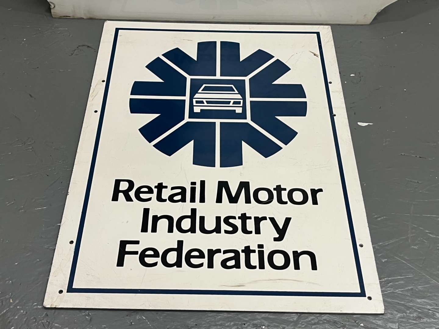 <p>Two Plastic Motor Agents Association Signs</p>