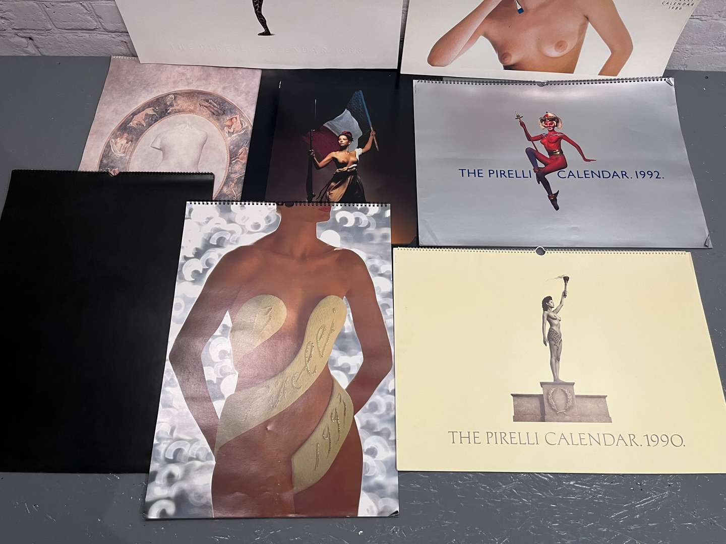 <p>Eight Pirelli Calendars&nbsp;</p>