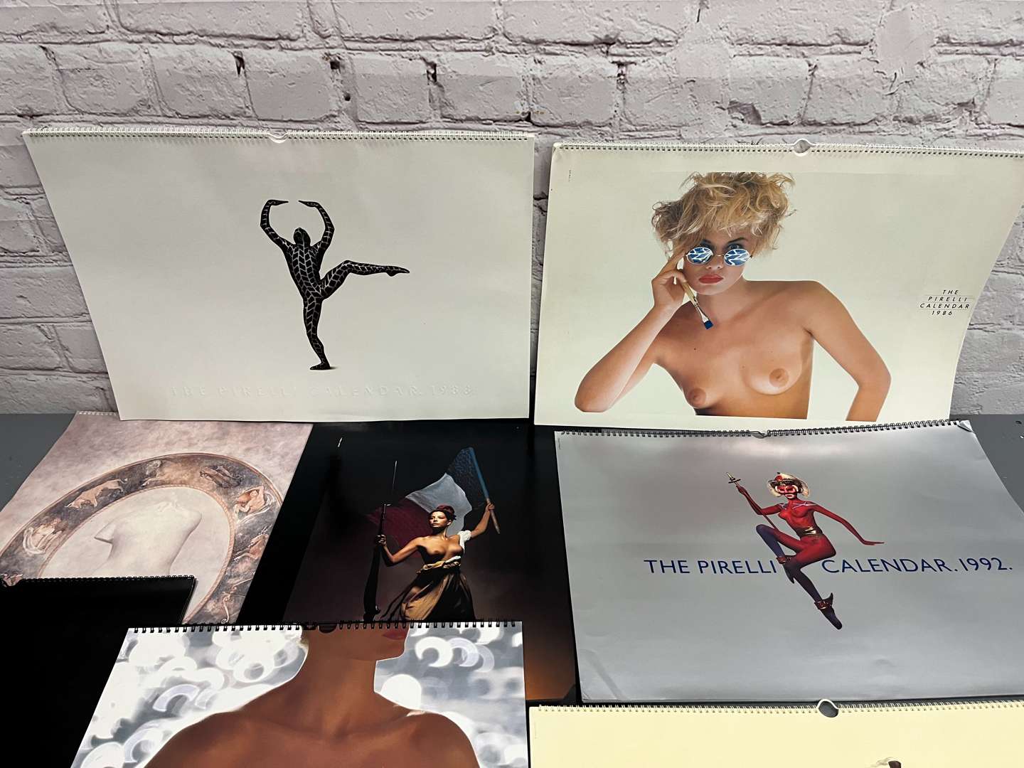 <p>Eight Pirelli Calendars&nbsp;</p>