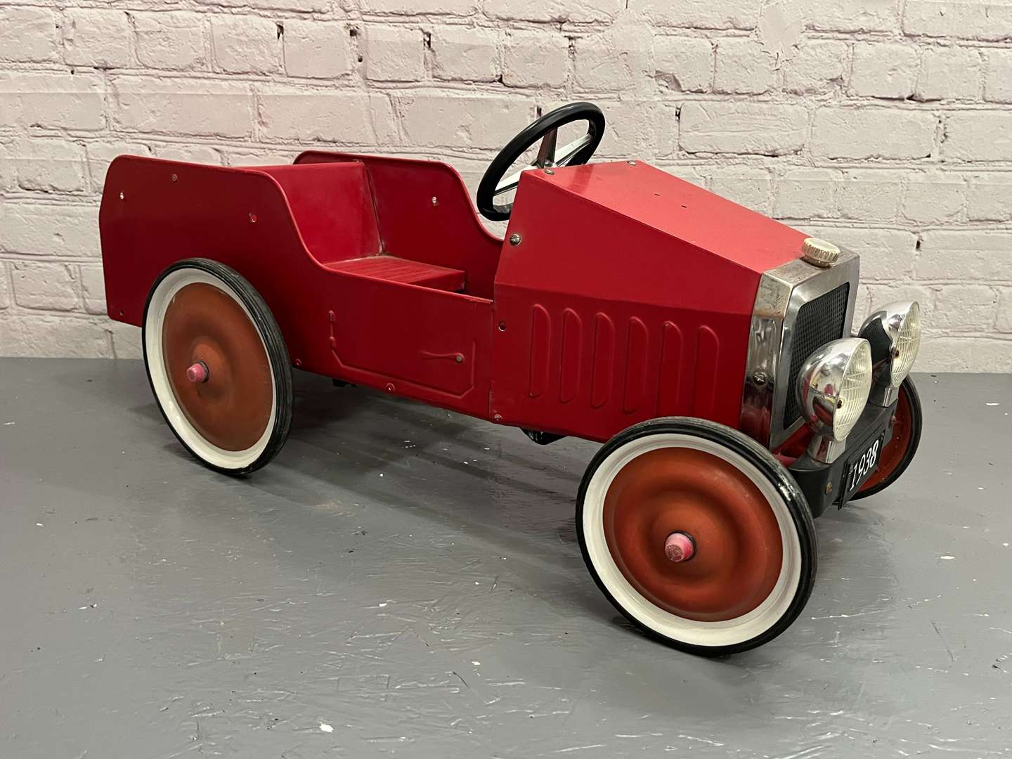 <p>Red Tin Plate Childs Pedal Car</p>