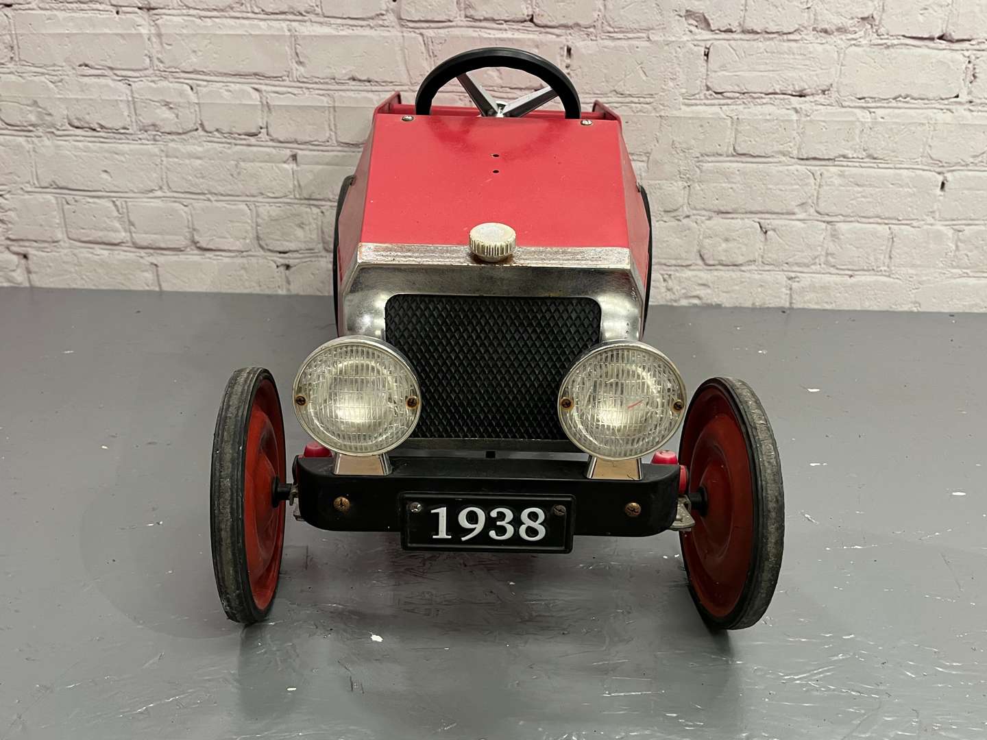 <p>Red Tin Plate Childs Pedal Car</p>