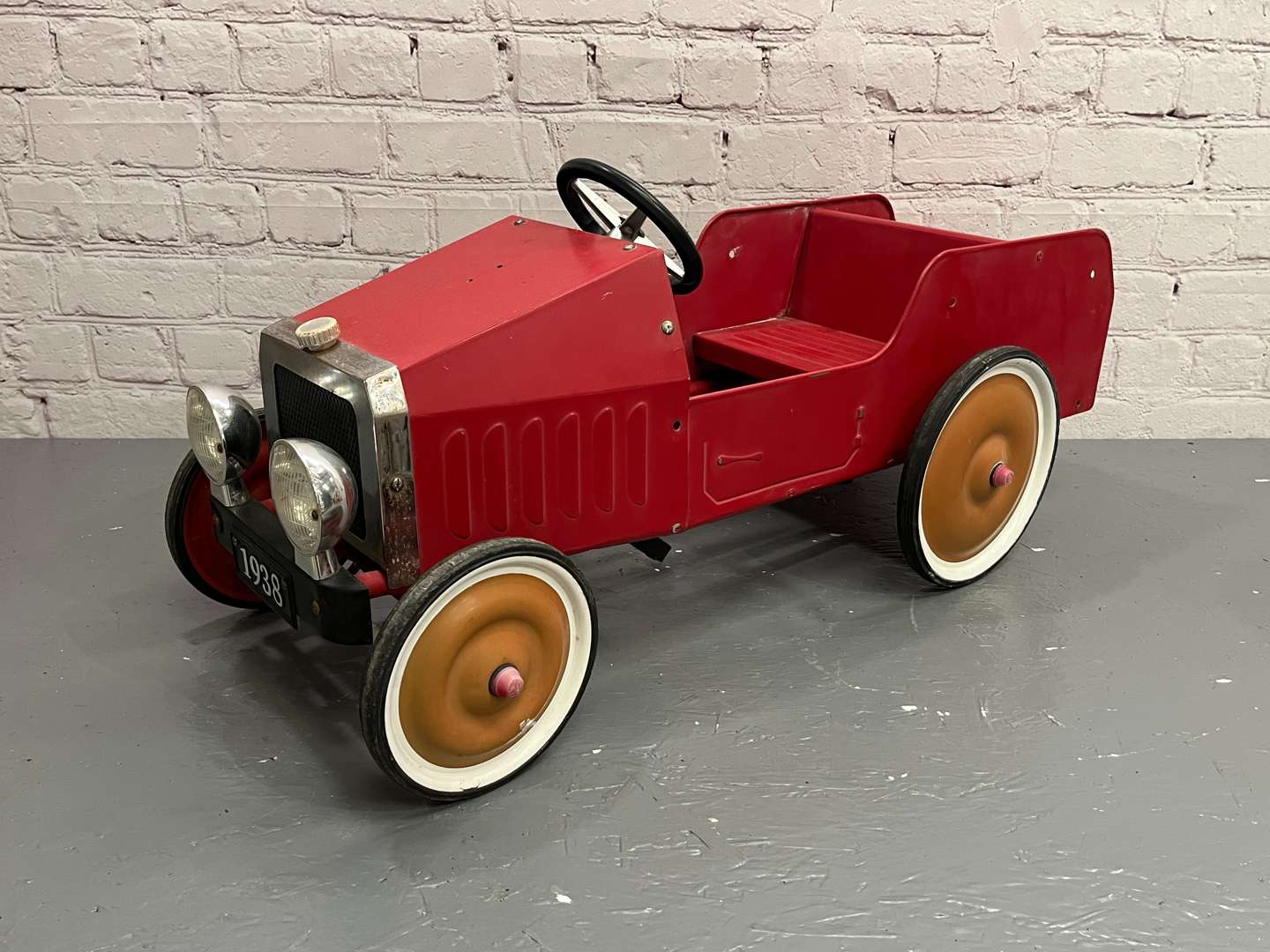 <p>Red Tin Plate Childs Pedal Car</p>