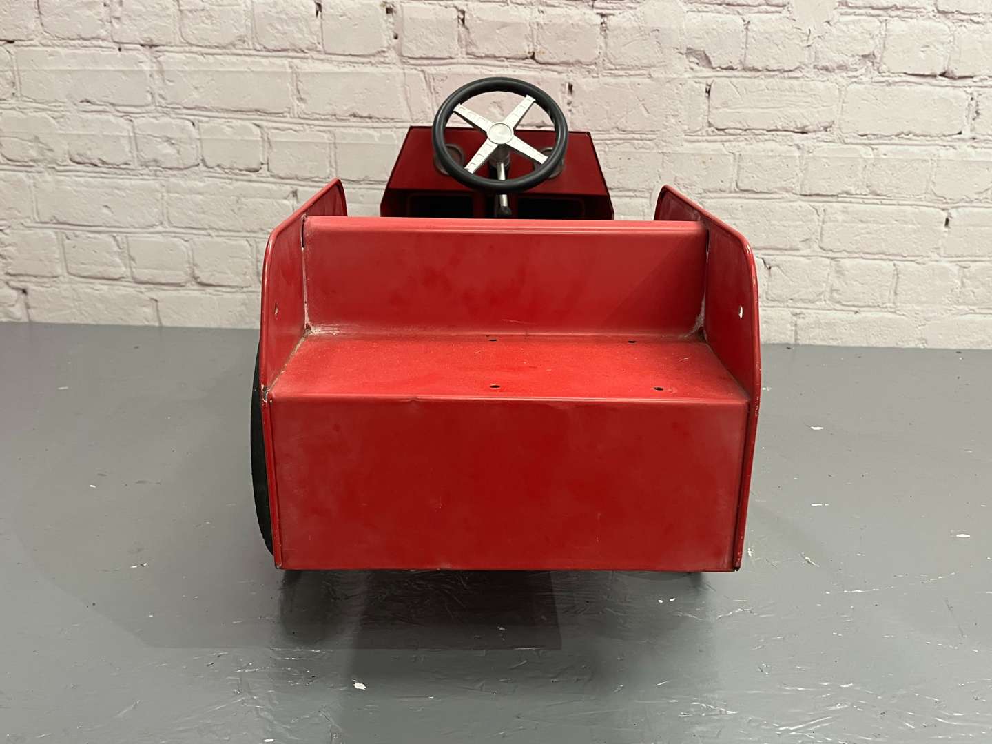 <p>Red Tin Plate Childs Pedal Car</p>