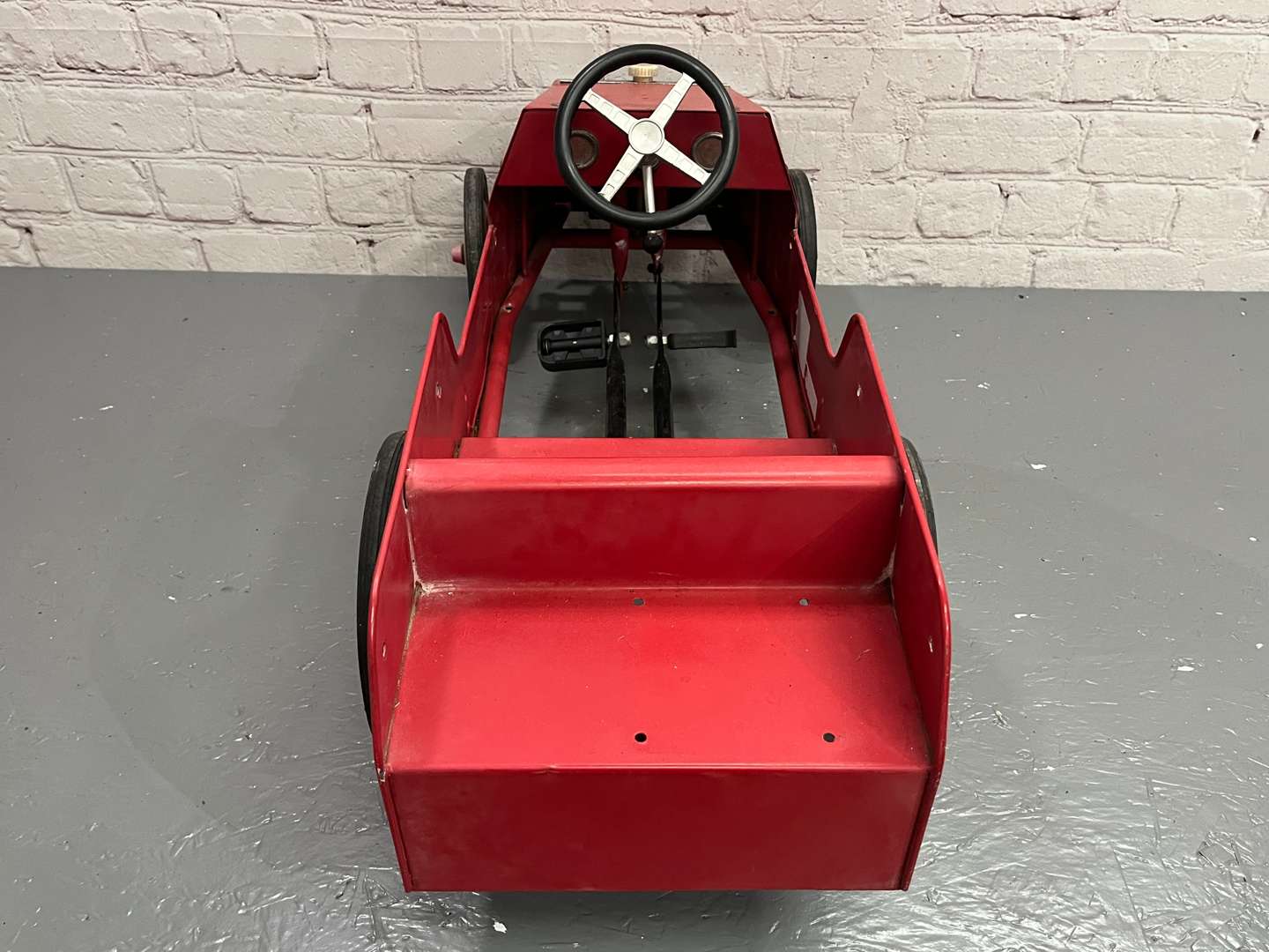 <p>Red Tin Plate Childs Pedal Car</p>