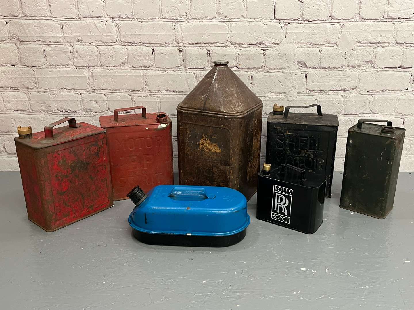 <p>Seven Assorted Fuel Cans</p>