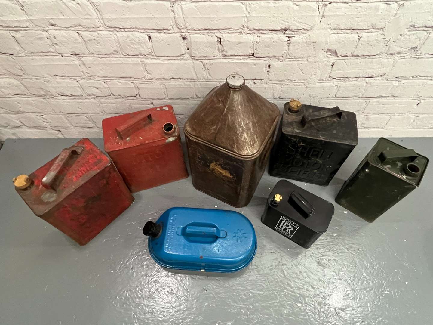<p>Seven Assorted Fuel Cans</p>