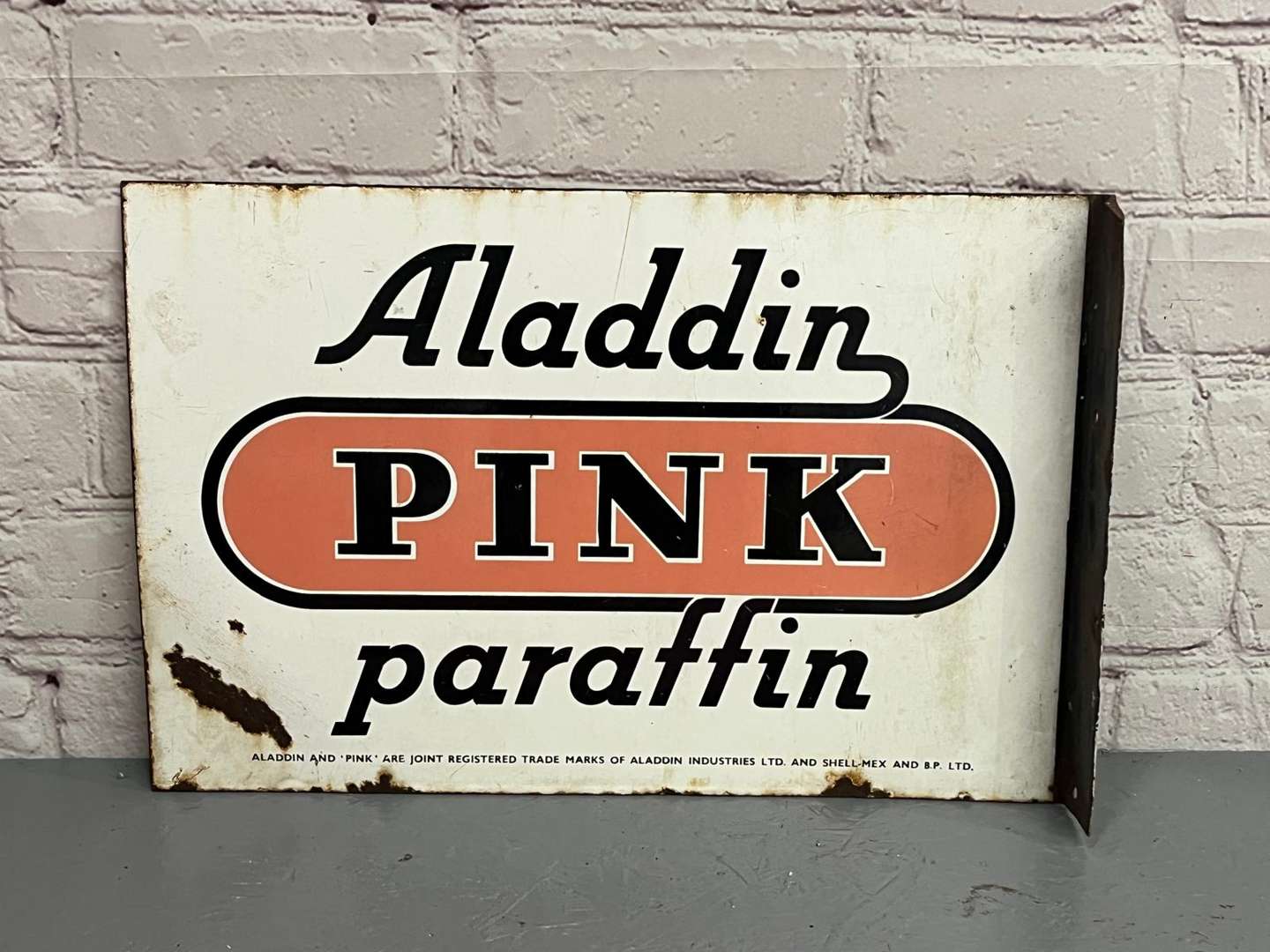 <p>Aladdin Pink Paraffin Enamel Flange Sign</p>