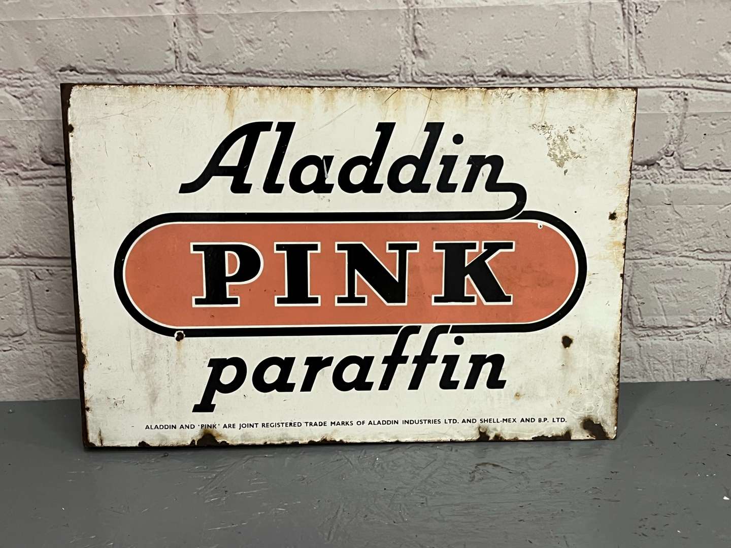 <p>Aladdin Pink Paraffin Enamel Flange Sign</p>